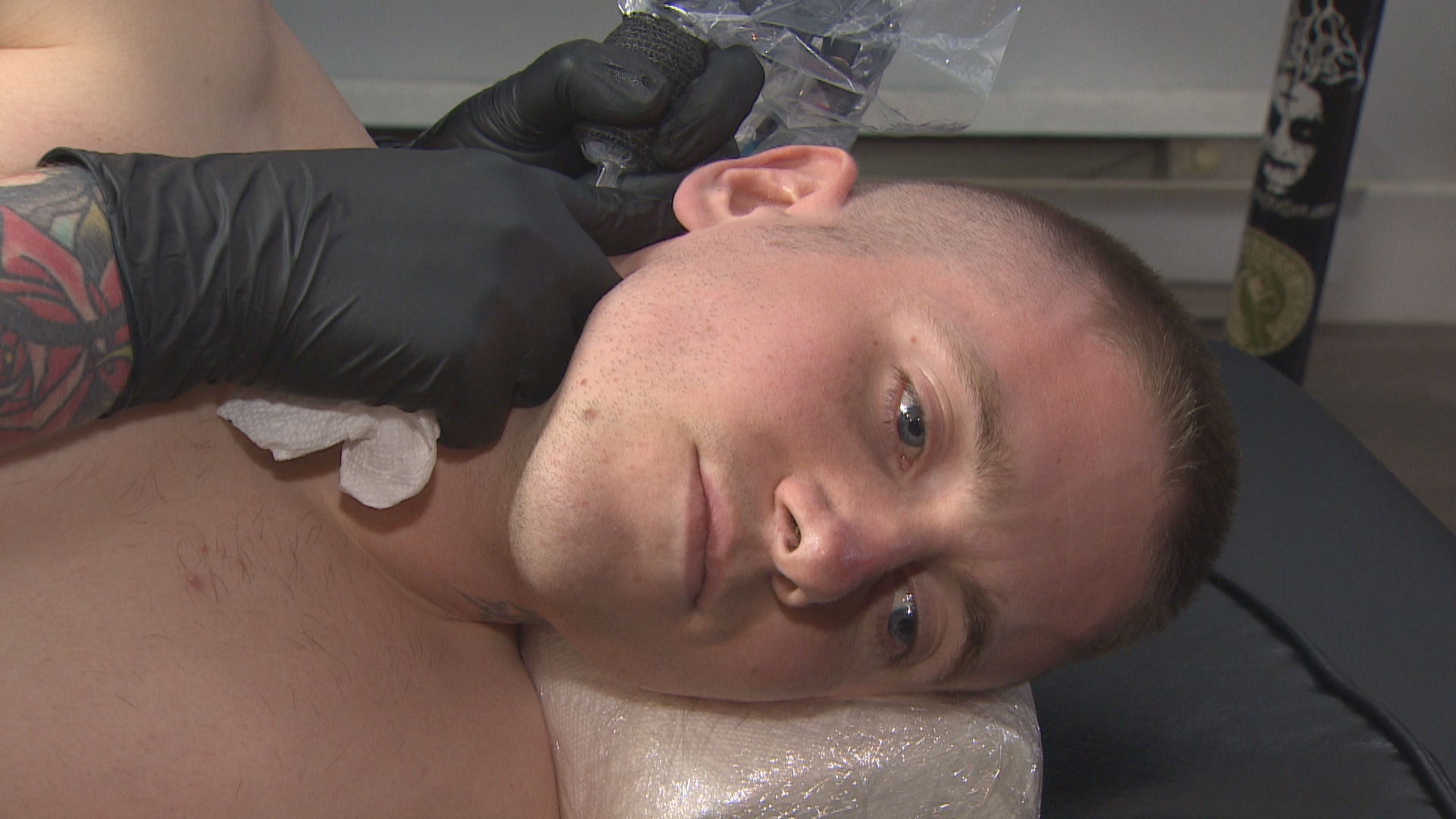 Evan Fry, 24, gets an old tattoo that reminds him of a former life covered up at a local St. John's shop. (Ted Dillon/CBC)