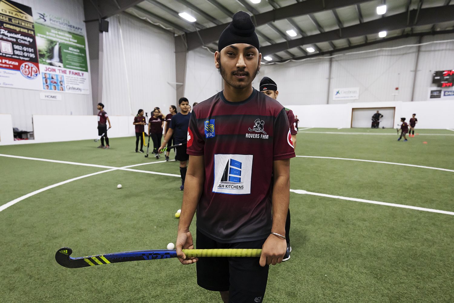 Gurwinder Singh, 17, waits for his turn to take a slap shot. The number of youth participating in the Rovers field hockey program has grown to 80 compared to three in 2015 when the sport first started in Winnipeg. 