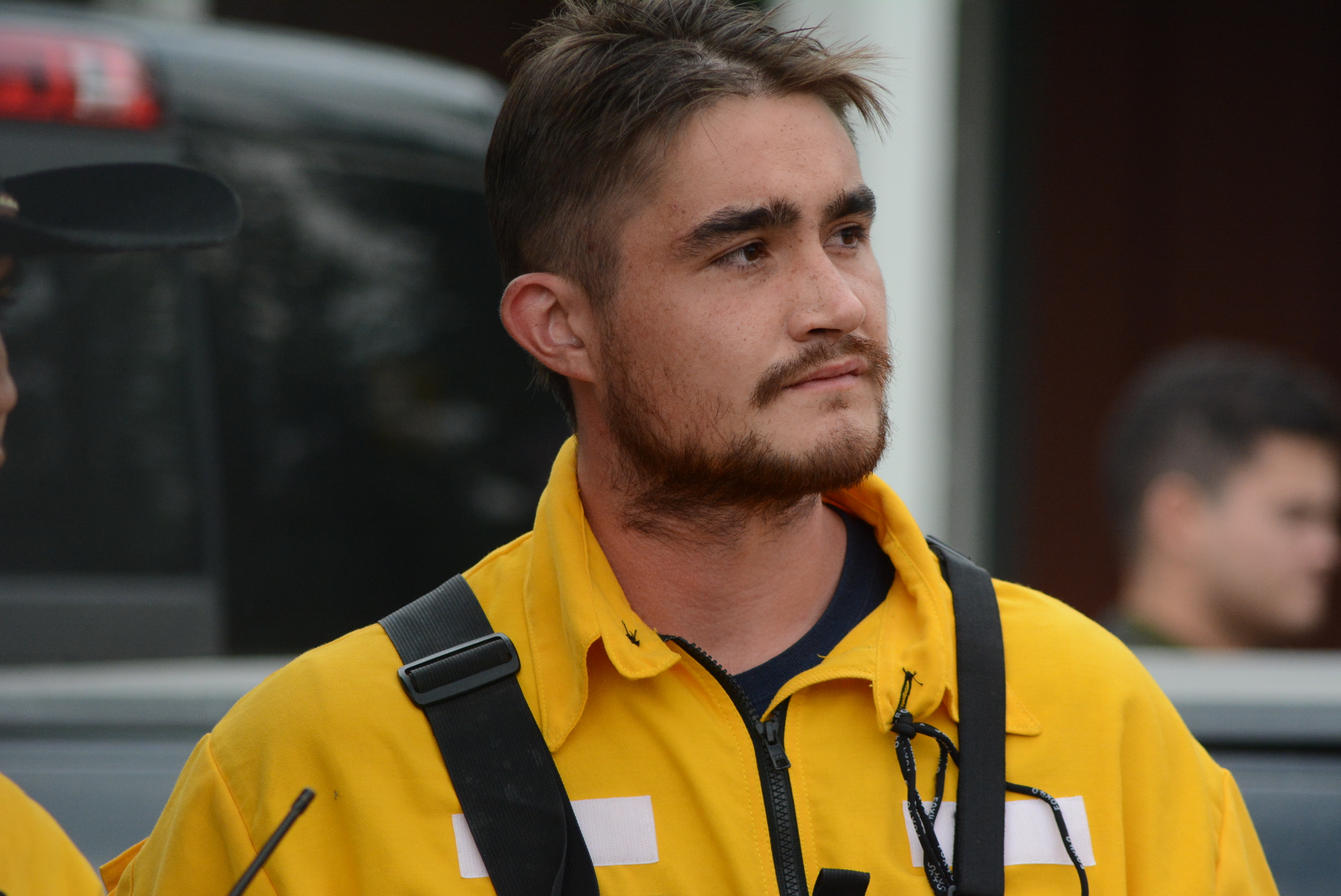 Firefighter Dustin Berard-Althouse listens to instructions as crews from Yukon First Nations Fire arrive in northern B.C. to help fight the Alkali Lake wildfire. (Philippe Morin/CBC)