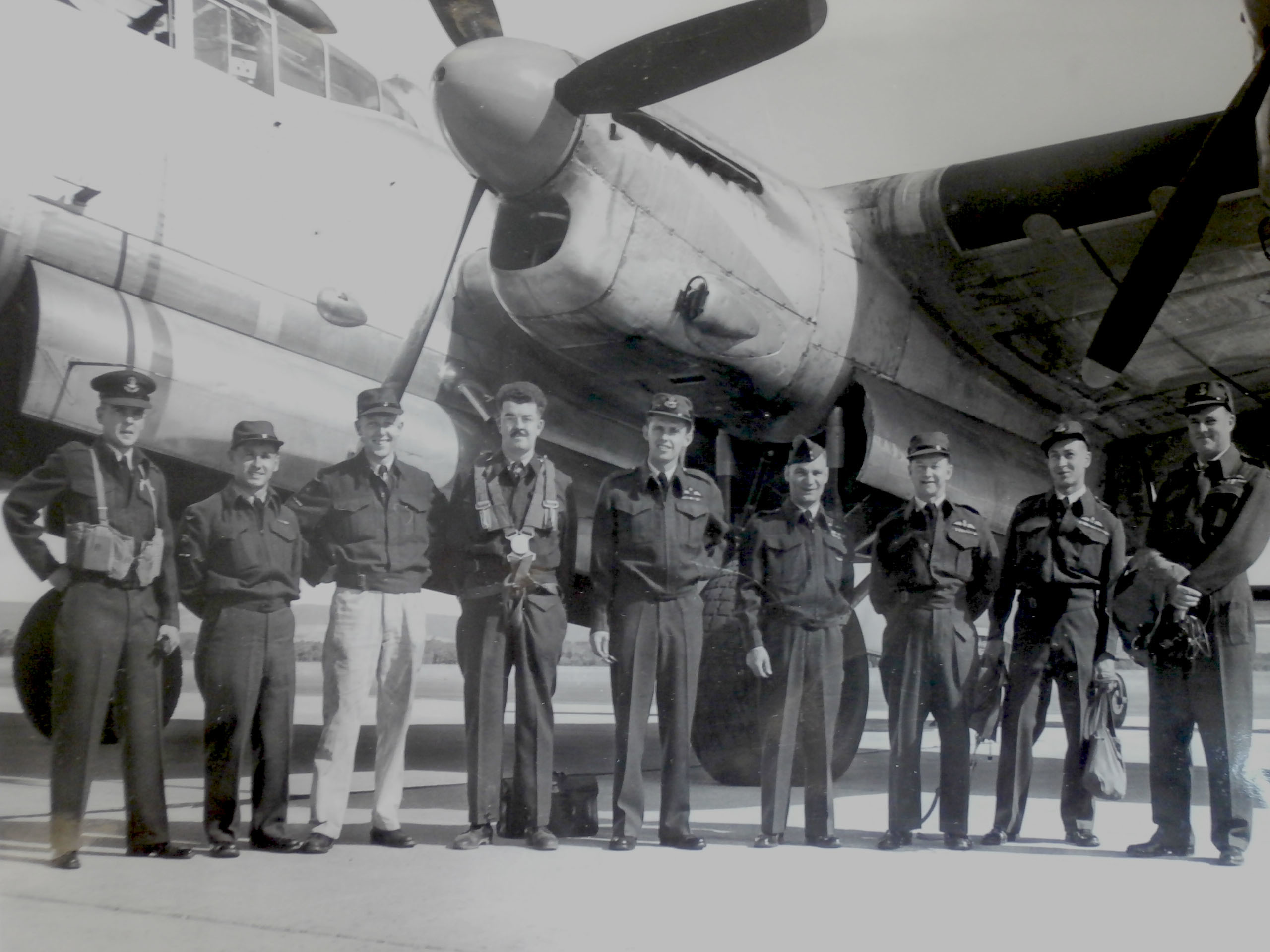 The flight crew of Lancaster 965 is shown in this photo, taken shortly before the crash. Flying Officer James McCutcheon is pictured in the centre, fifth from the left. (Submitted by Richard Mayne/RCAF) 