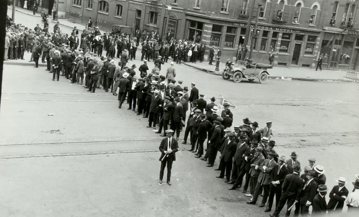 Specials at the corner of Market Avenue and Main Street on June 21, 1919. (L.B. Foote Collection/Archives of Manitoba)