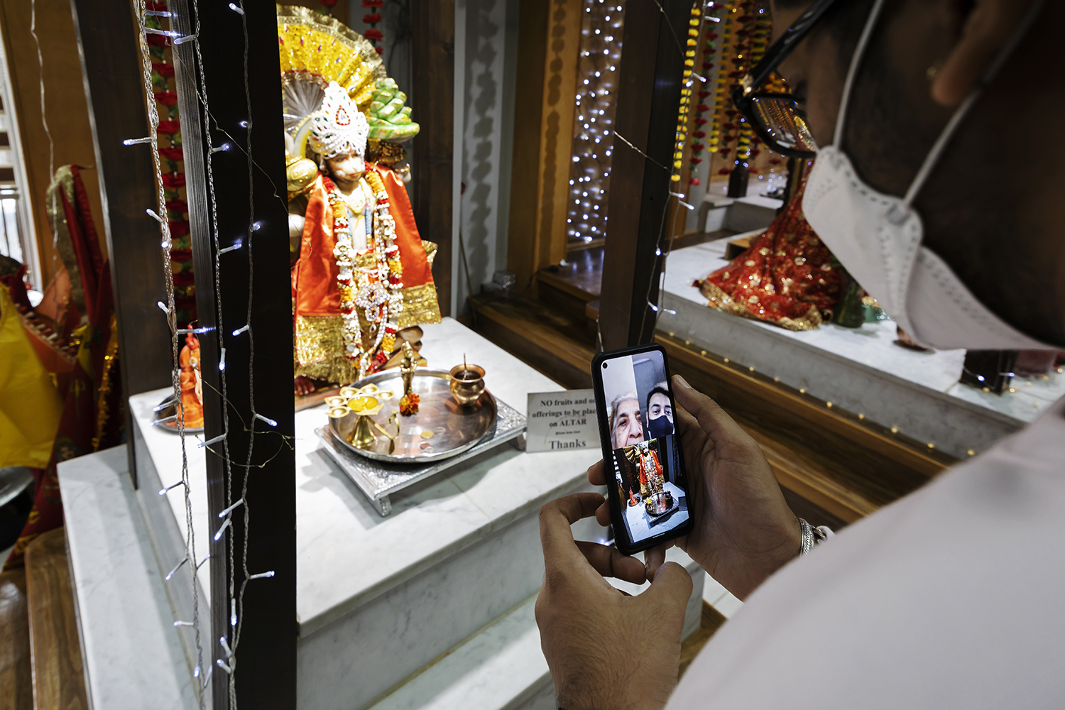 Khattar talks to his grandmother and father on a video call, showing them the temple he attends in Winnipeg for the first time. (Prabhjot Singh Lotey/CBC)