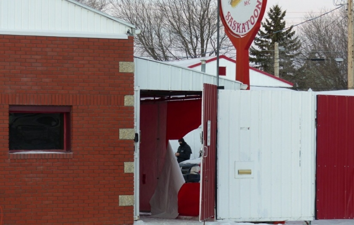 Police inside the Hells Angels compound in Saskatoon during the raid. (Dan Zakreski/CBC)