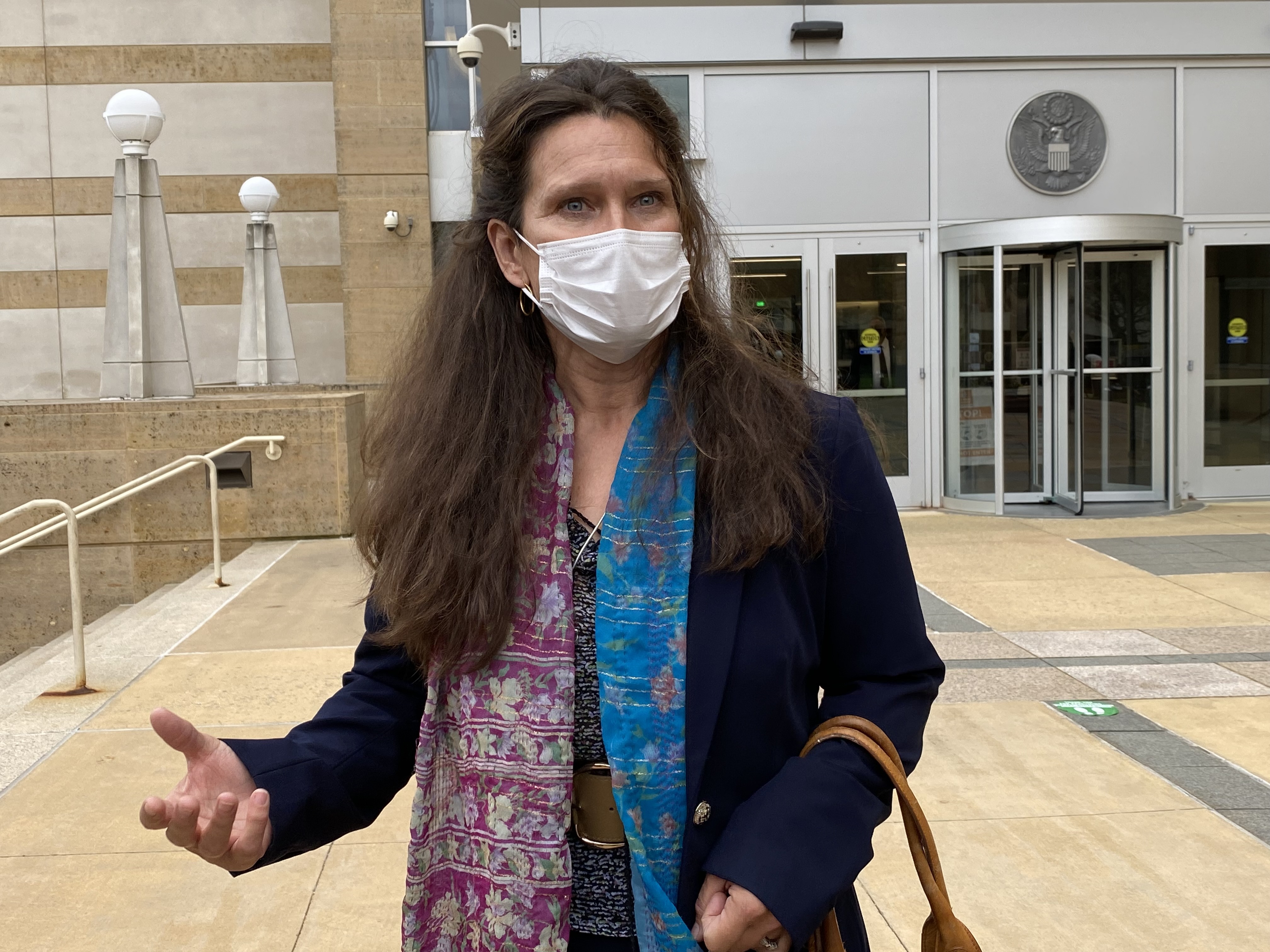 Mathews's mother, Kimberley Penhall, speaks with reporters outside the Maryland court where her son was sentenced. (Karen Pauls/CBC)