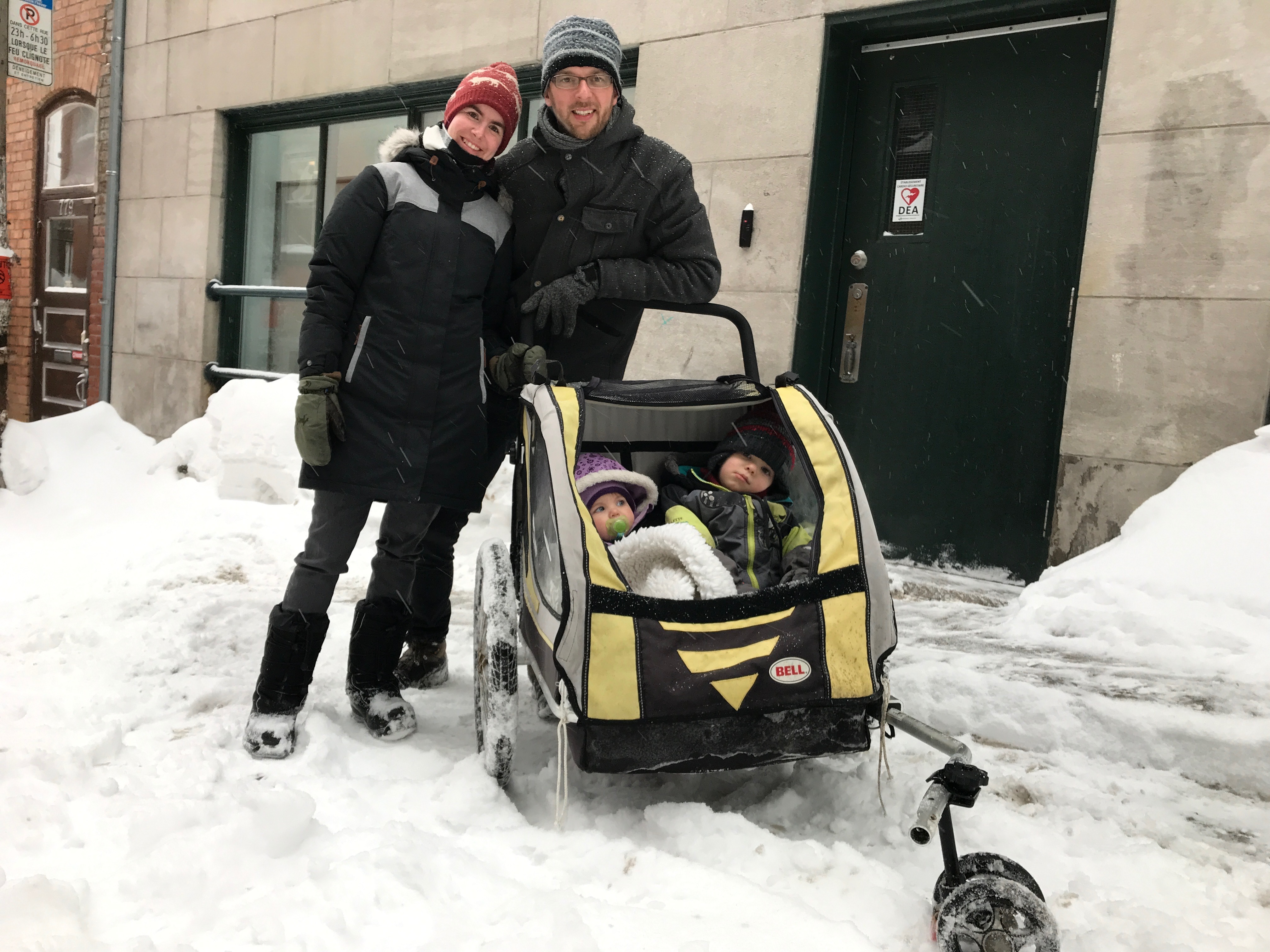 Sébastien and Hélène Trépanier say winter is physically demanding when leaving the house with their kids, two-year-old Paul and one-year-old Gabrielle. (Julia Caron/CBC)