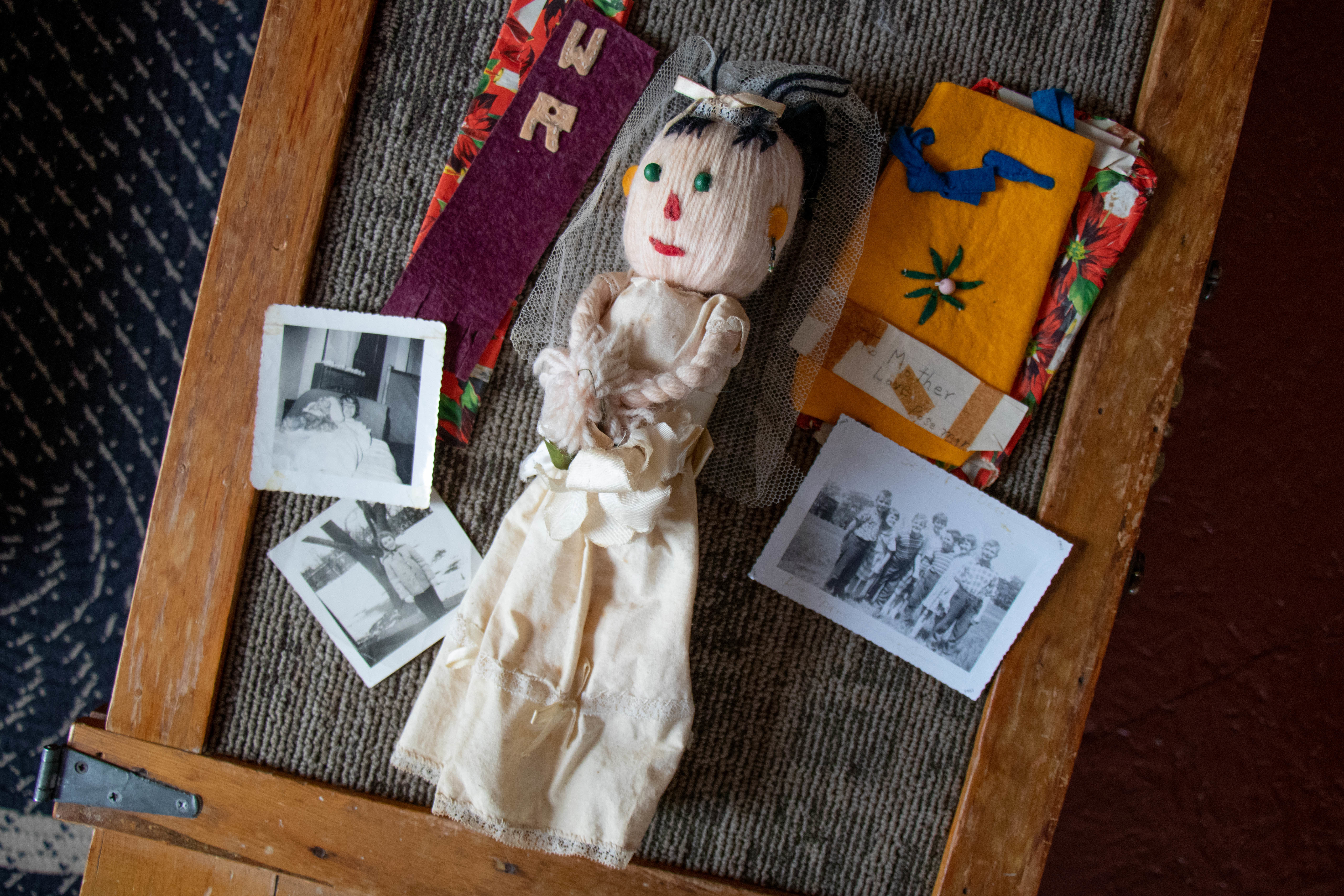 This doll is one of the few things Ross-Brimble has kept from her time at the deaf schools. (Robert Short/CBC)