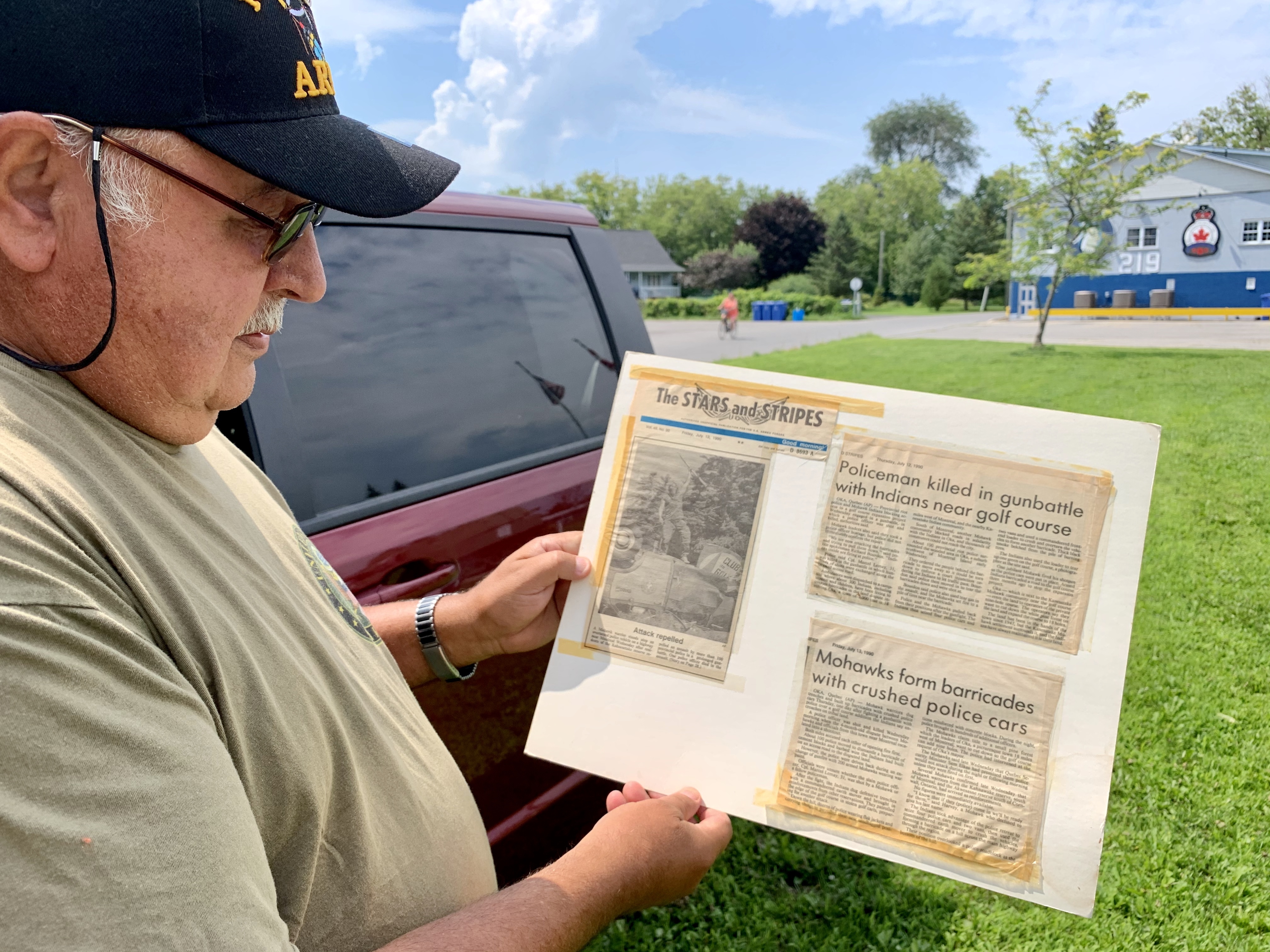 Ray Deer is the president of the Royal Canadian Legion Branch 219. He's kept newspaper clippings from the summer of 1990. (Jessica Deer/CBC)