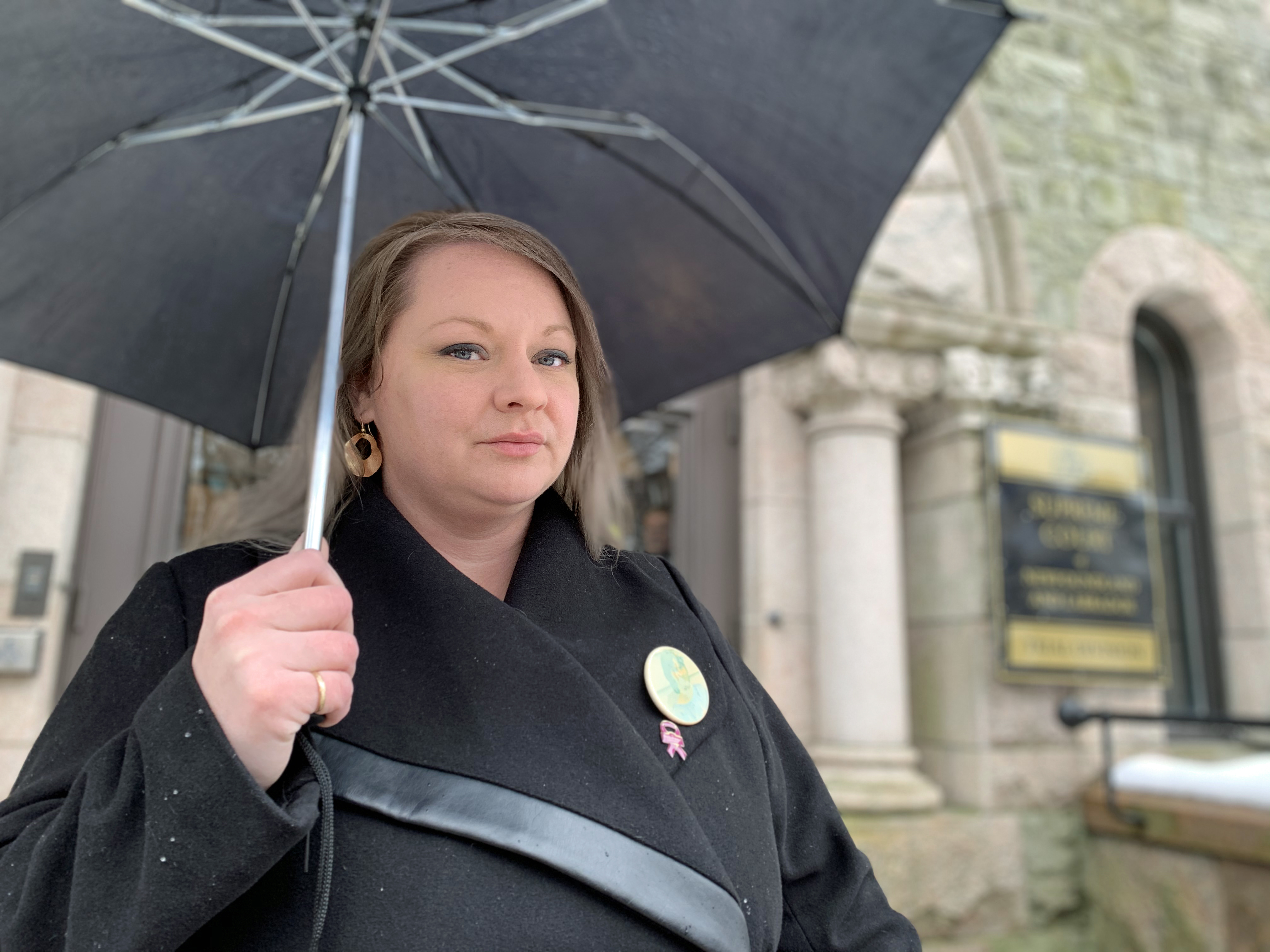 Lauralee Gillingham on the steps of the Supreme Court of Newfoundland and Labrador. (Ariana Kelland/CBC)