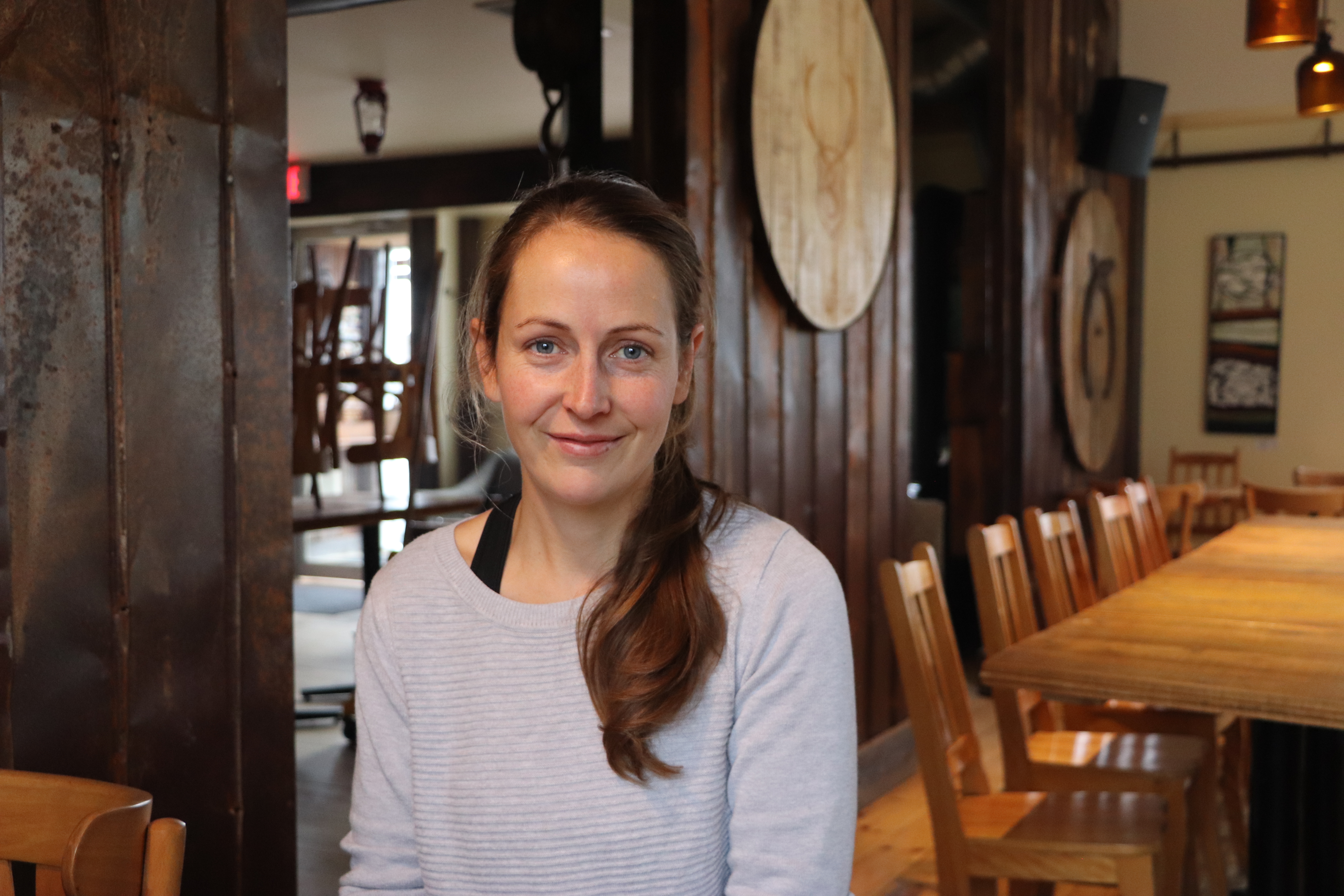 Annabelle Goupil, the manager and co-founder of the Pub de la Contrée and Microbrasserie de Bellechasse, said the co-operative model has strengthened the microbrewery’s place in the community. (Julia Page/CBC)