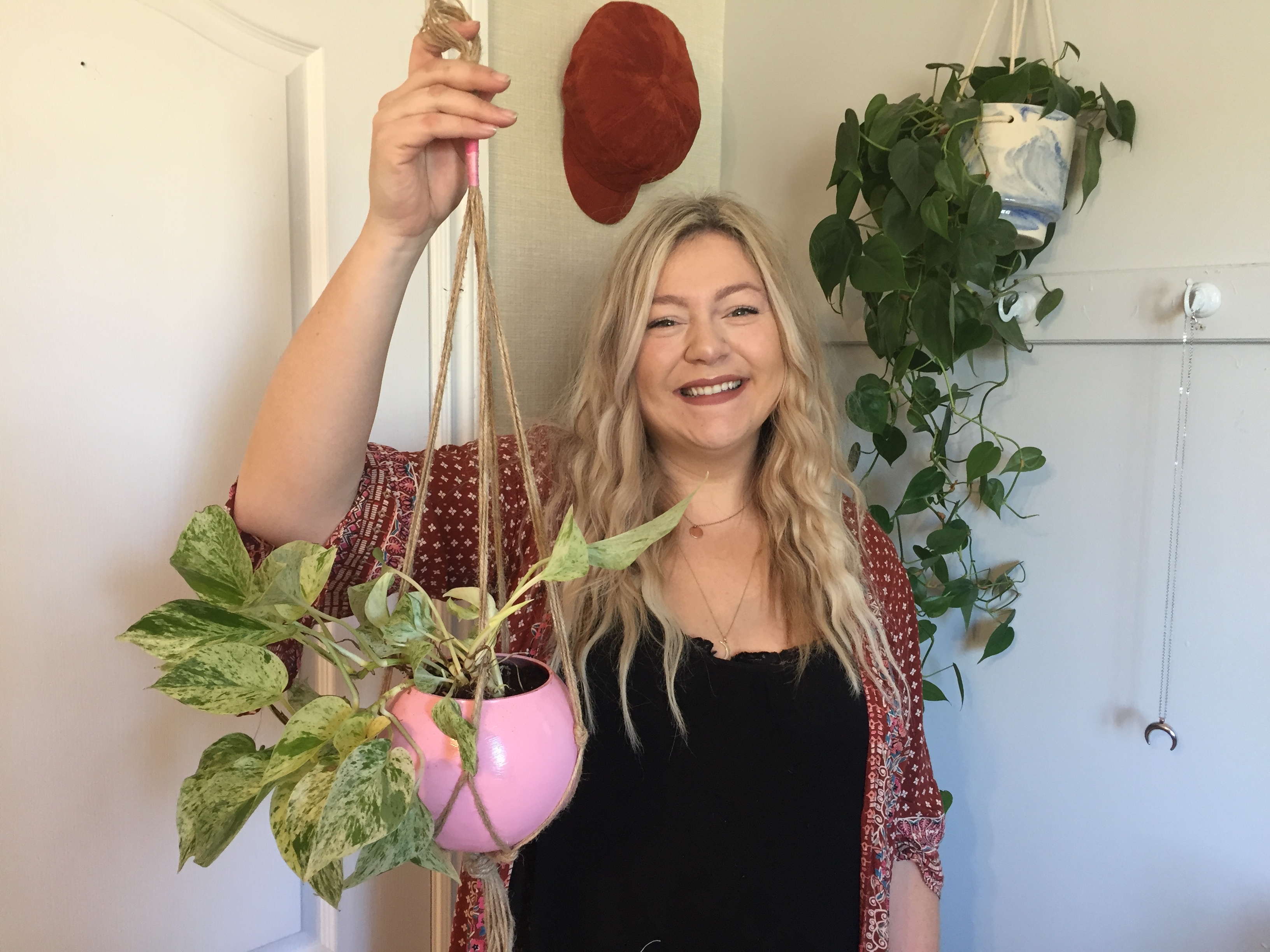 Shila Pennell sells hanging planters, paintings and wall hangings on her online business, the Lighthouse Company. (Stephanie Tobin/CBC)