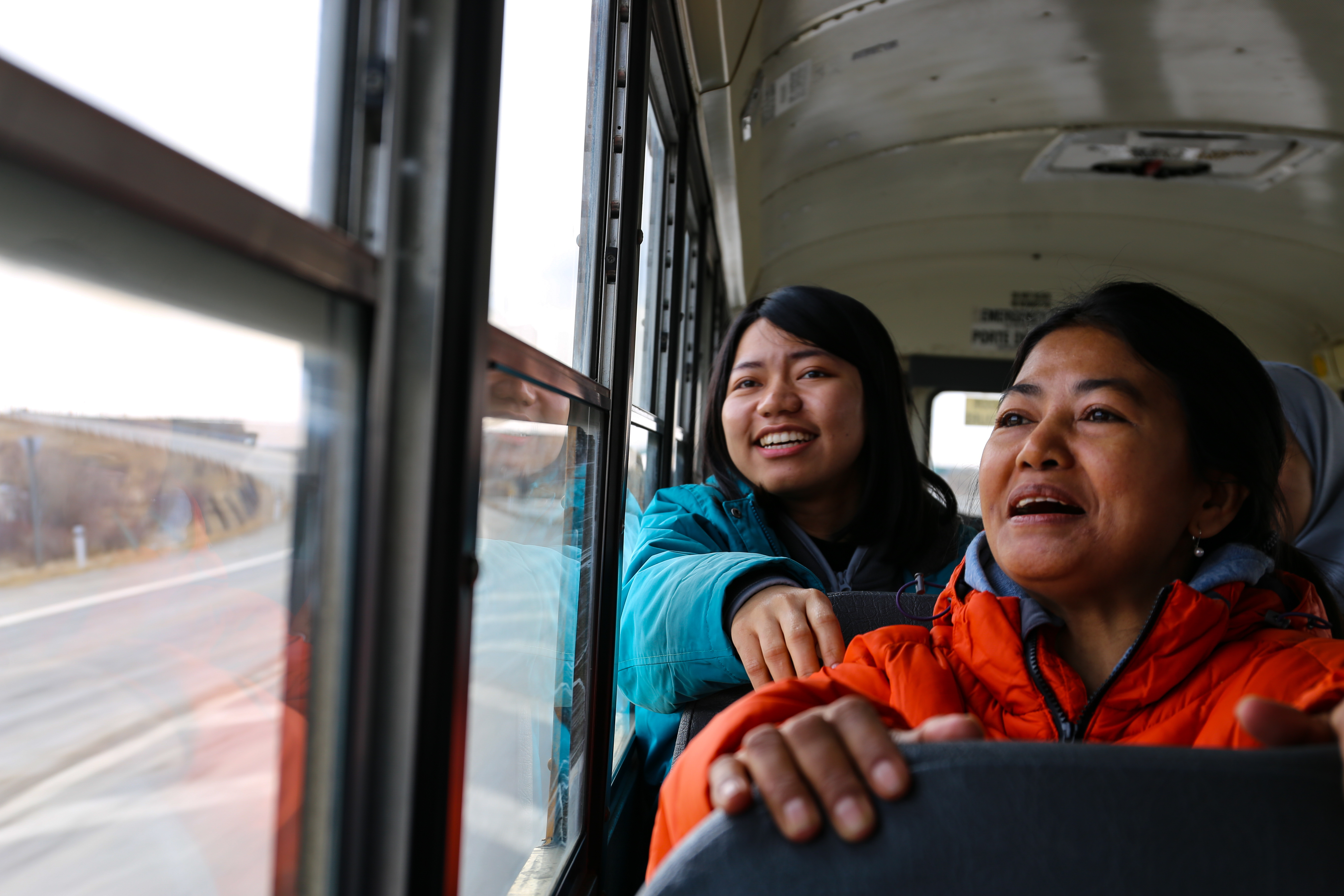 Khet Soe and Ciang Uap's eyes light up when they see the Rocky Mountains for the first time. (Emily Rendell-Watson/CBC)