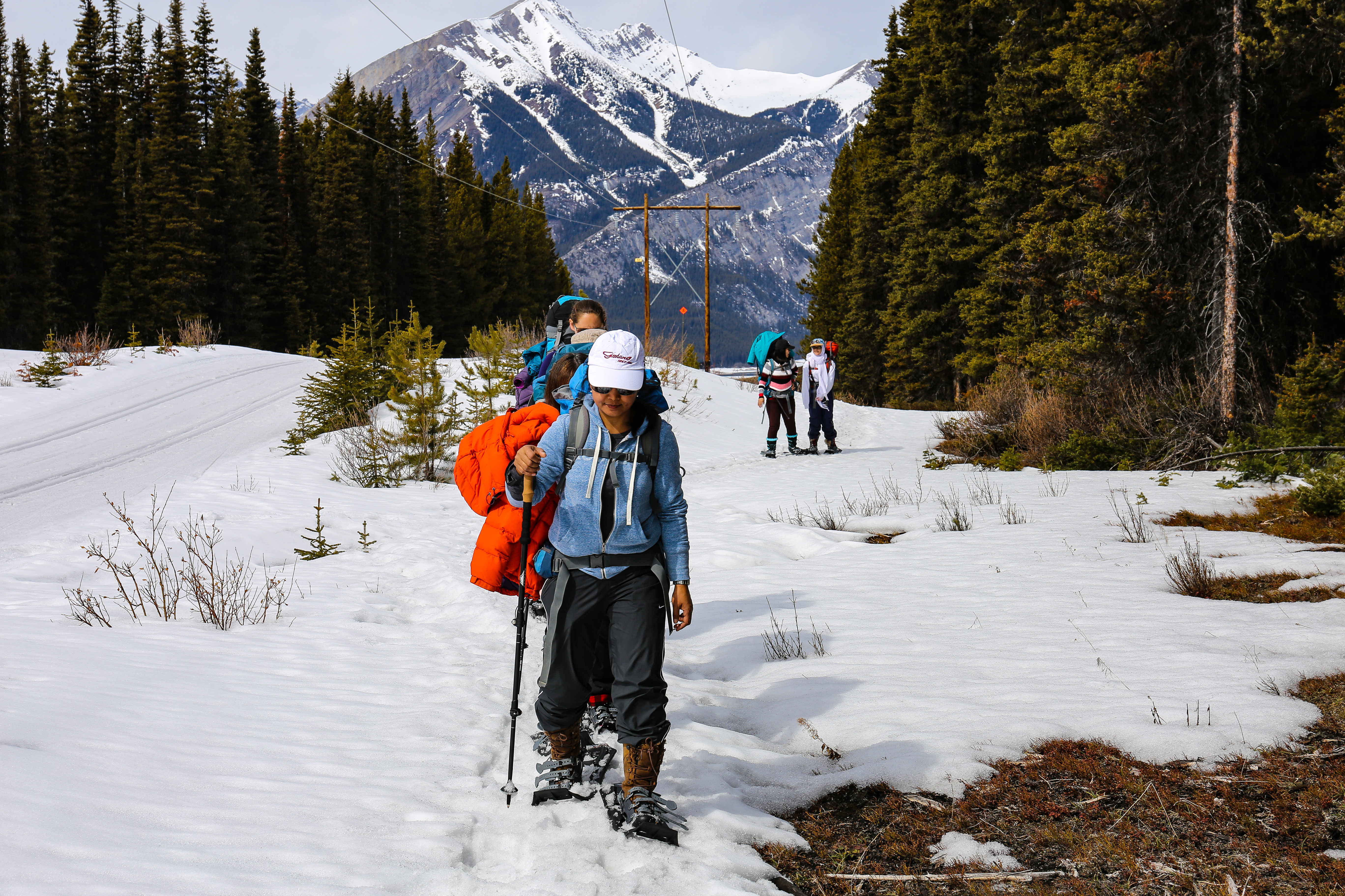 Khet Soe takes the lead as they hike under the hydro line that follows the trail for most of the route. (Emily Rendell-Watson/CBC)