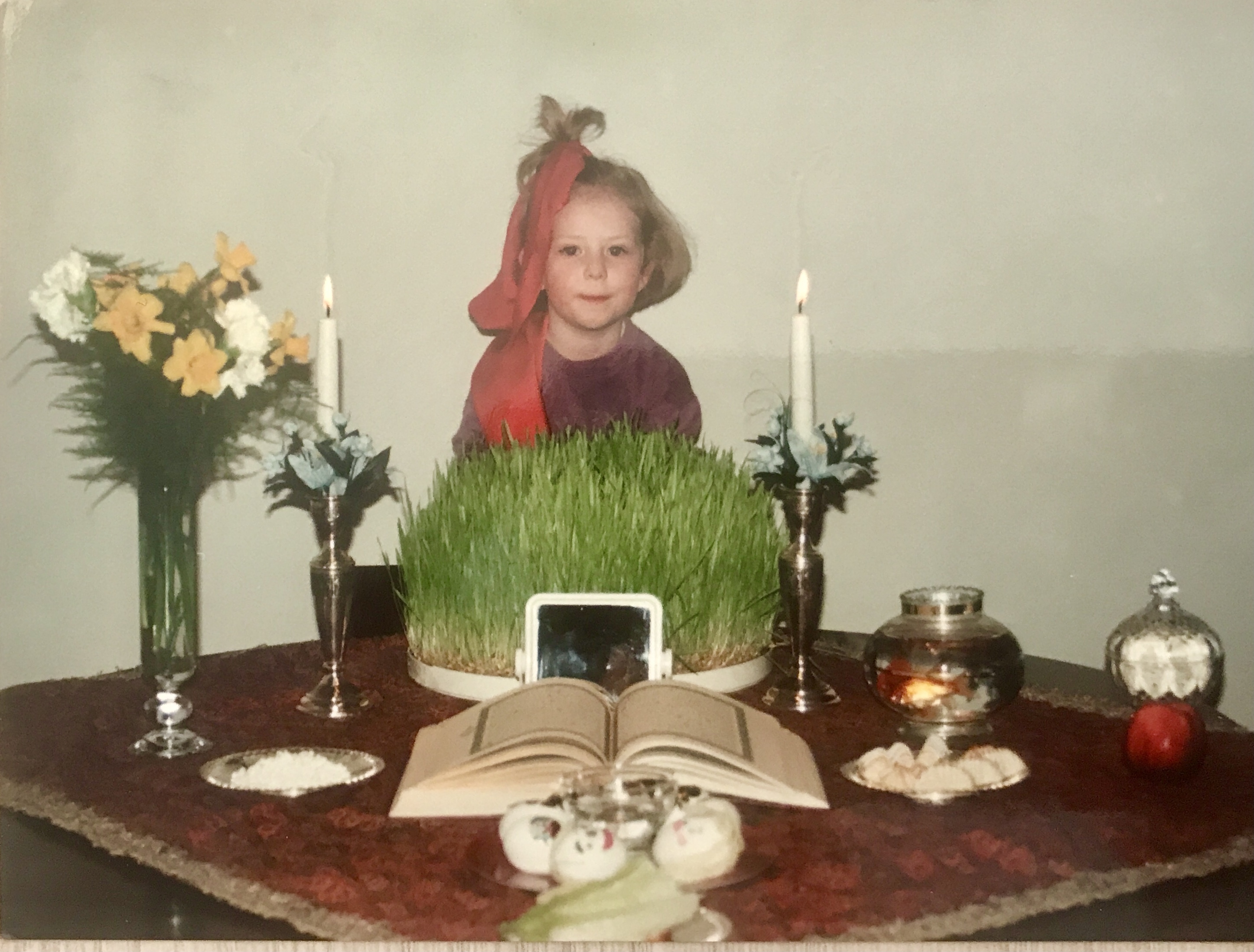 CBC reporter Tina Lovgreen at four years old, at the family Nowruz table in Tehran, Iran. (Tina Lovgreen/CBC)