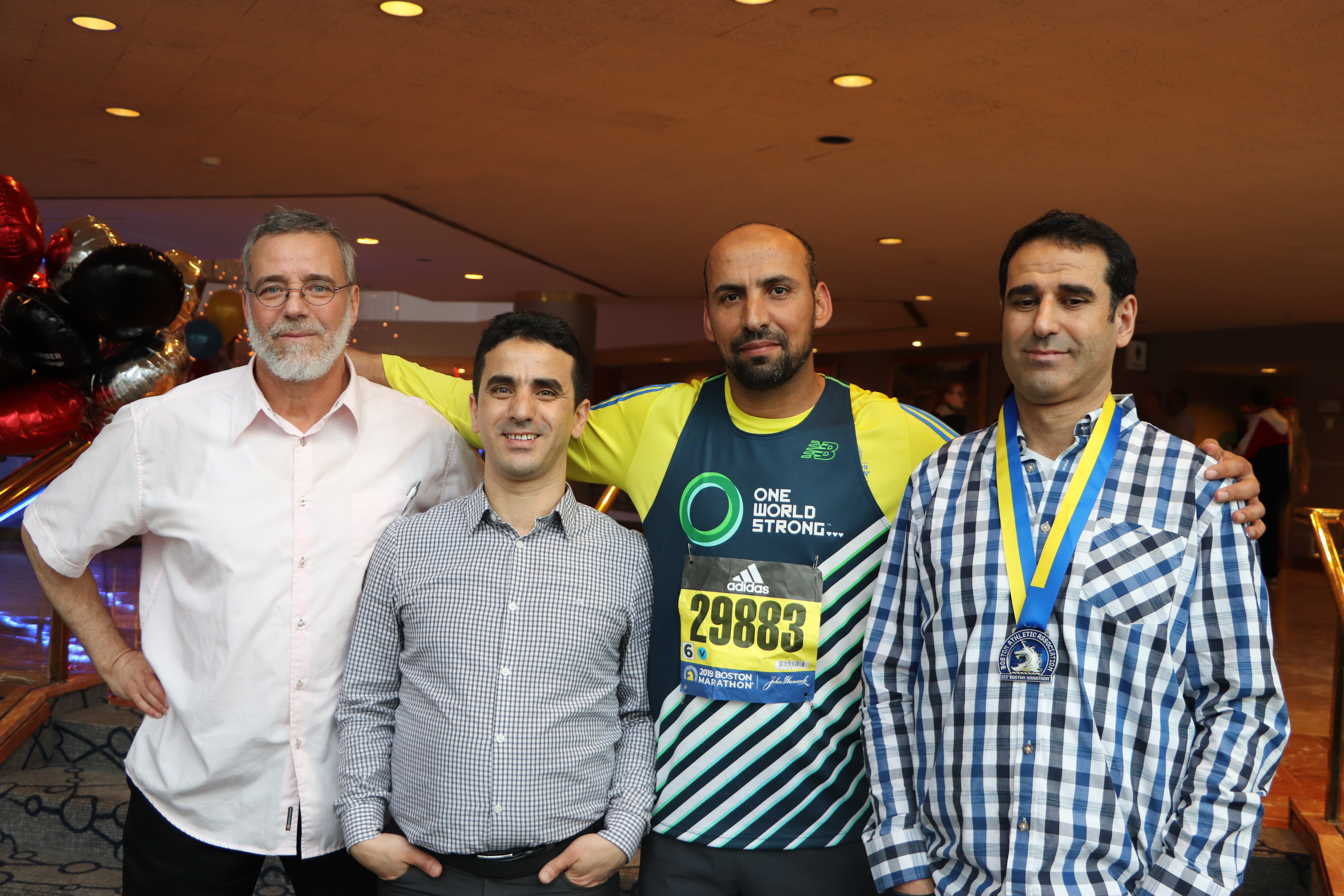 From left, Hakim Chambaz, Abdelhak Achouri, Saïd Akjour and Ahmed Cheddadi celebrated in Saïd’s victory, each taking a turn at wearing the prestigious medal. (Julia Page/CBC)