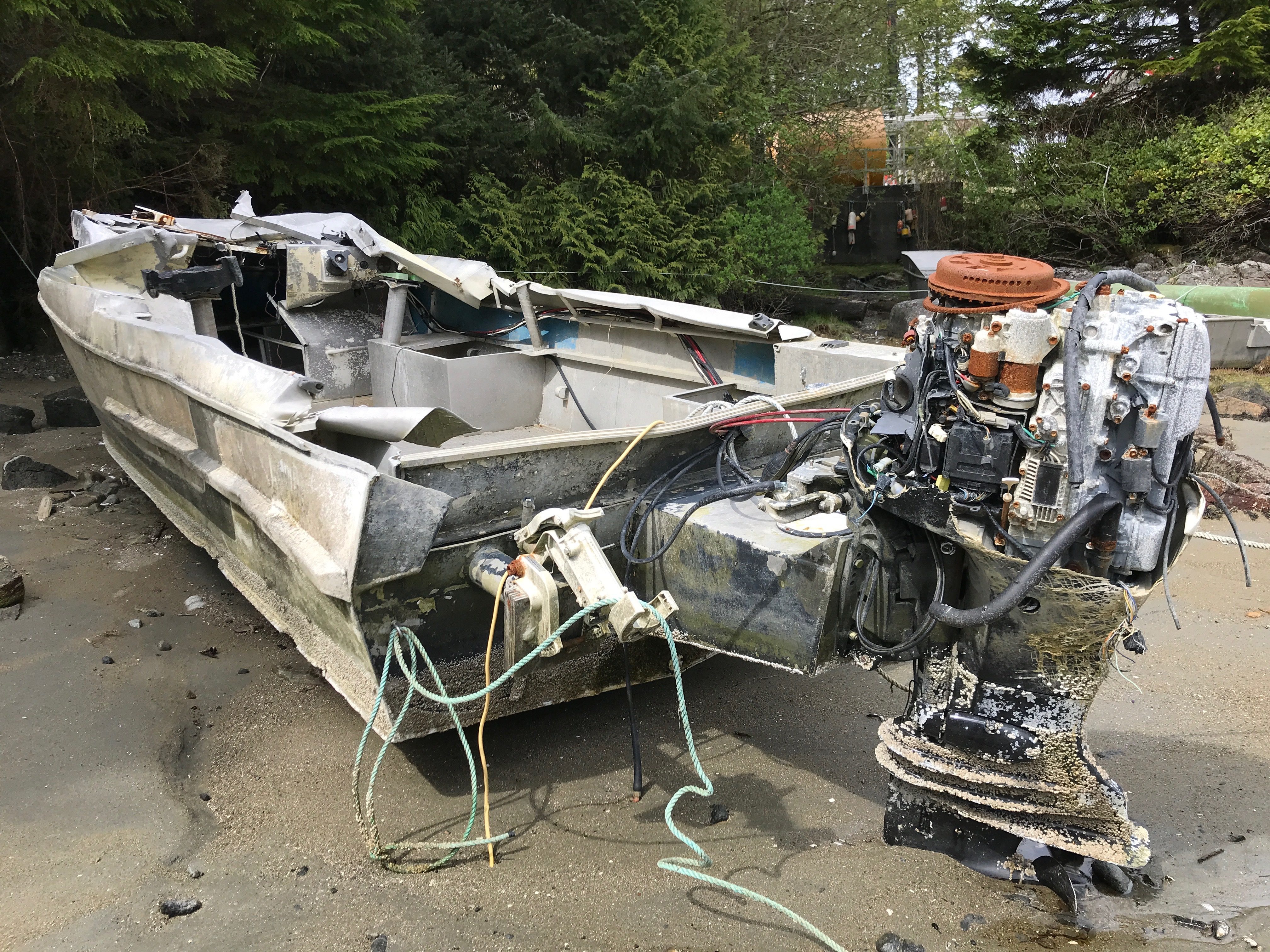 A boat that overturned near the reef in front of the lighthouse is a reminder of what is at stake. (Megan Thomas/CBC)