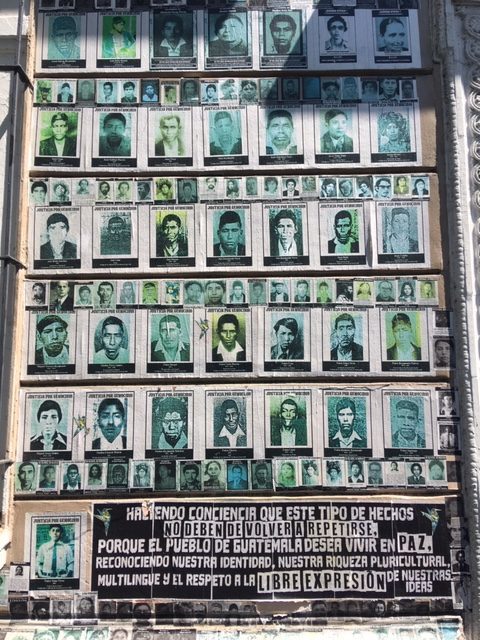 Portraits of people who have disappeared in Guatemala line walls in Guatemala City (Nahlah Ayed/CBC)