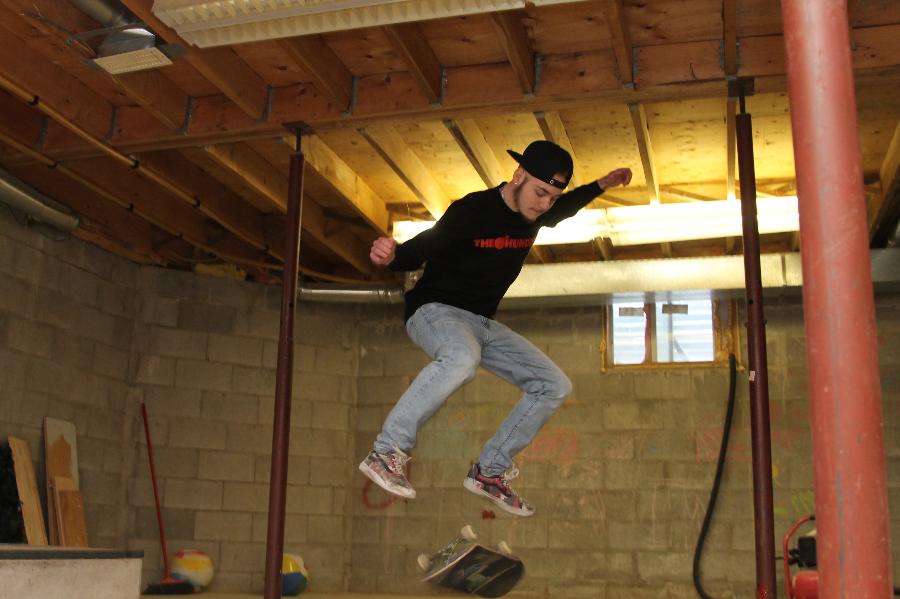 Skateboarding is a huge part of Kian's life and he's set up a skate park in his basement. (Stu Mills/CBC)