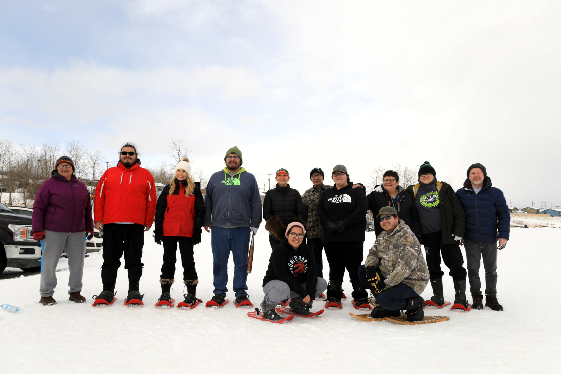 The Rhoda Hardlotte Memorial High School snowshoe baseball team poses for a picture on the frozen Churchhill River before stepping up to bat on February 28, 2020. (Heidi Atter/CBC)