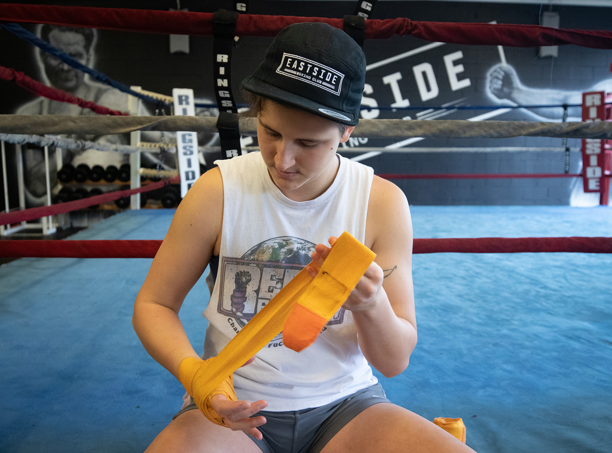 Iva Jankovic puts on her hand wraps before boxing. She has been training at Eastside Boxing for two years. (Maryse Zeidler/CBC)