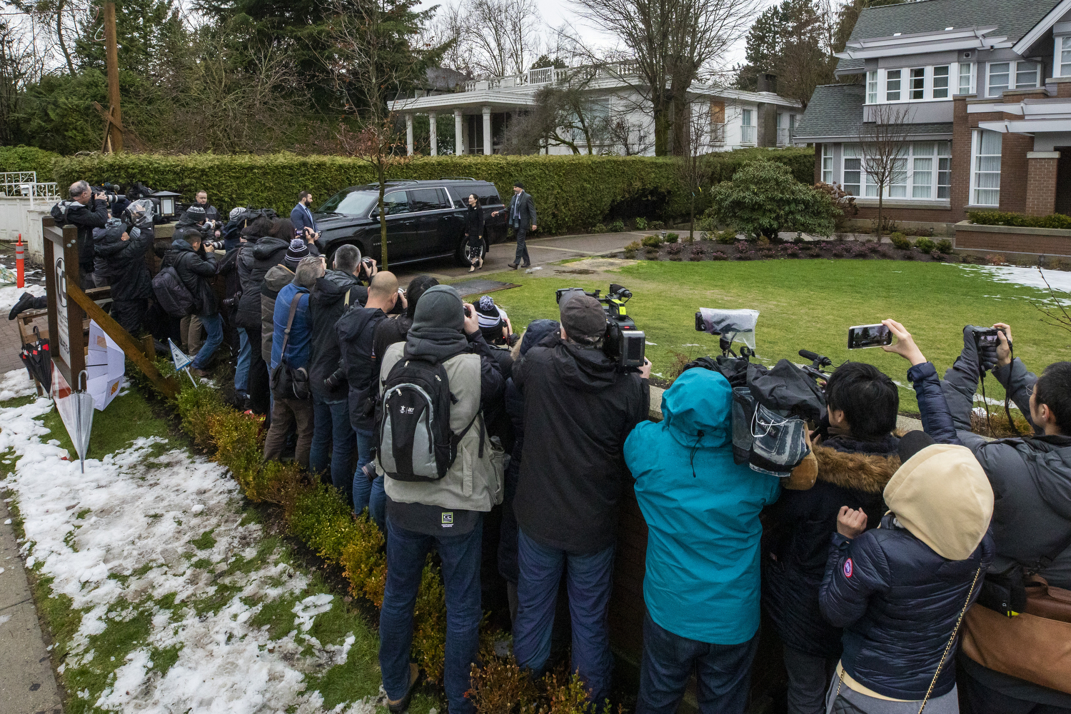 Media photograph Huawei's chief financial officer Meng Wanzhou as she leaves her house to attend her extradition hearing at the B.C Supreme Court in Vancouver on Monday, Jan. 20, 2020. (Ben Nelms/CBC Vancouver) 