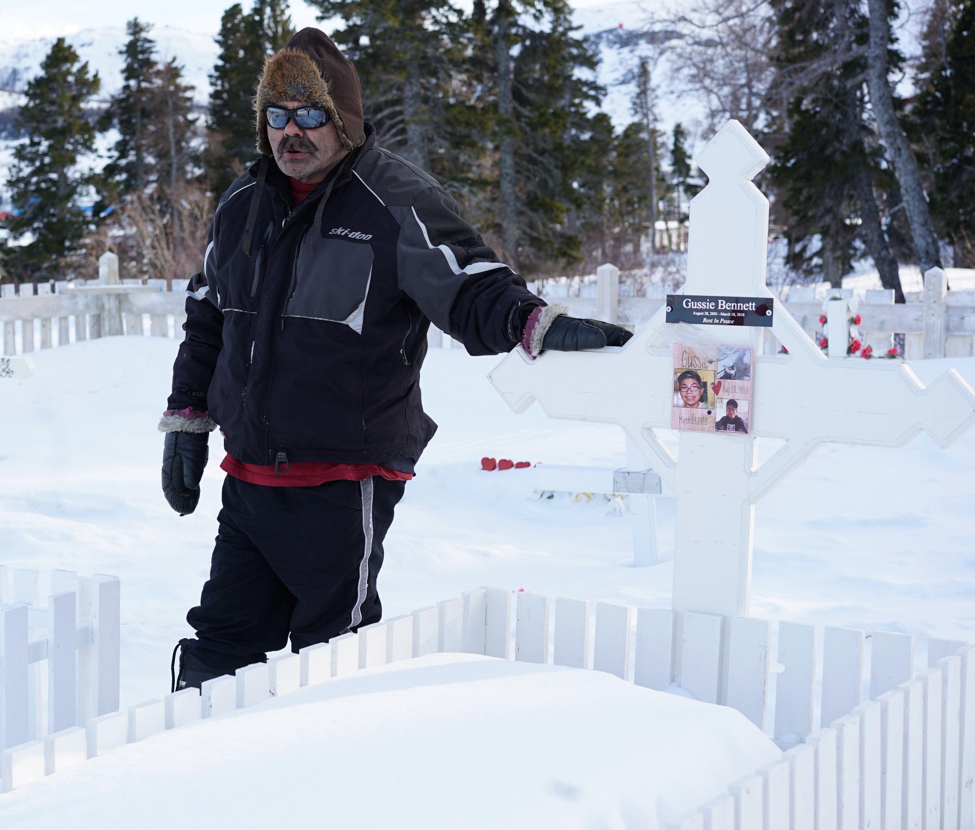 Jim Bennett at his son's grave. (Ossie Michelin/CBC)