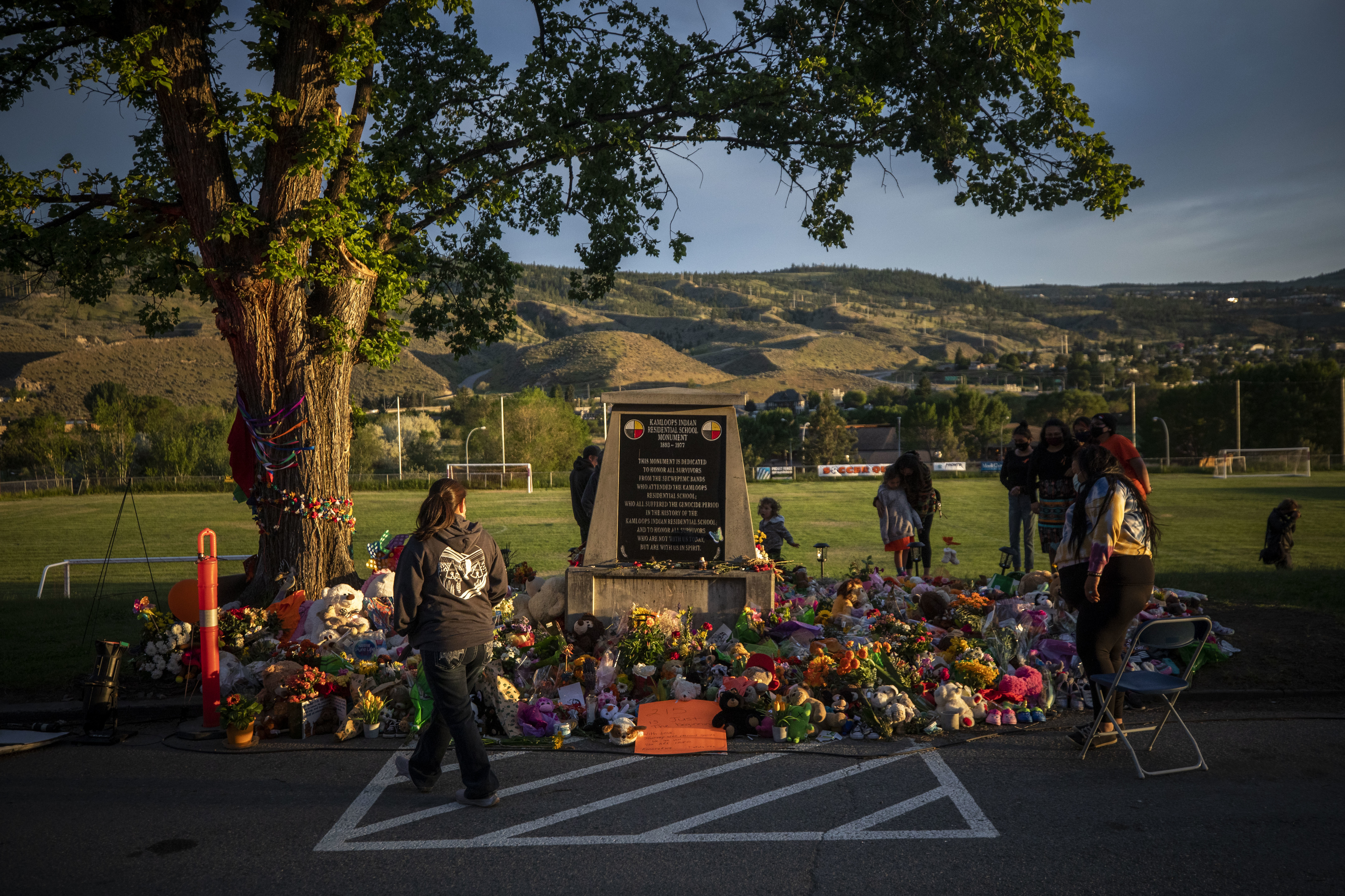 The sun sets on the memorial outside of the former Kamloops Indian Residential School.