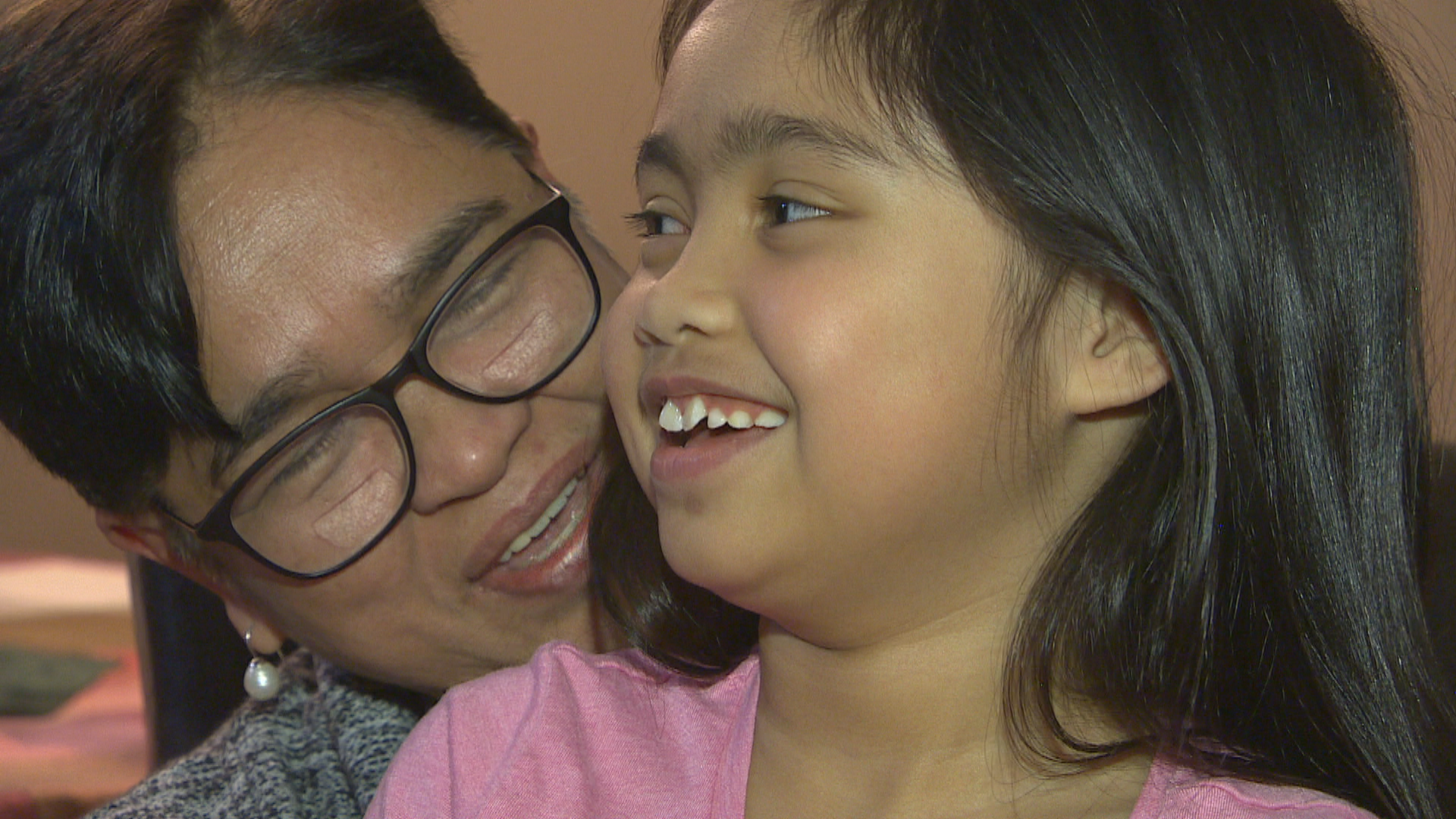 Lexie Ontong, 7, sits with her grandmother, Angelita Ontong. (Travis Golby/CBC)