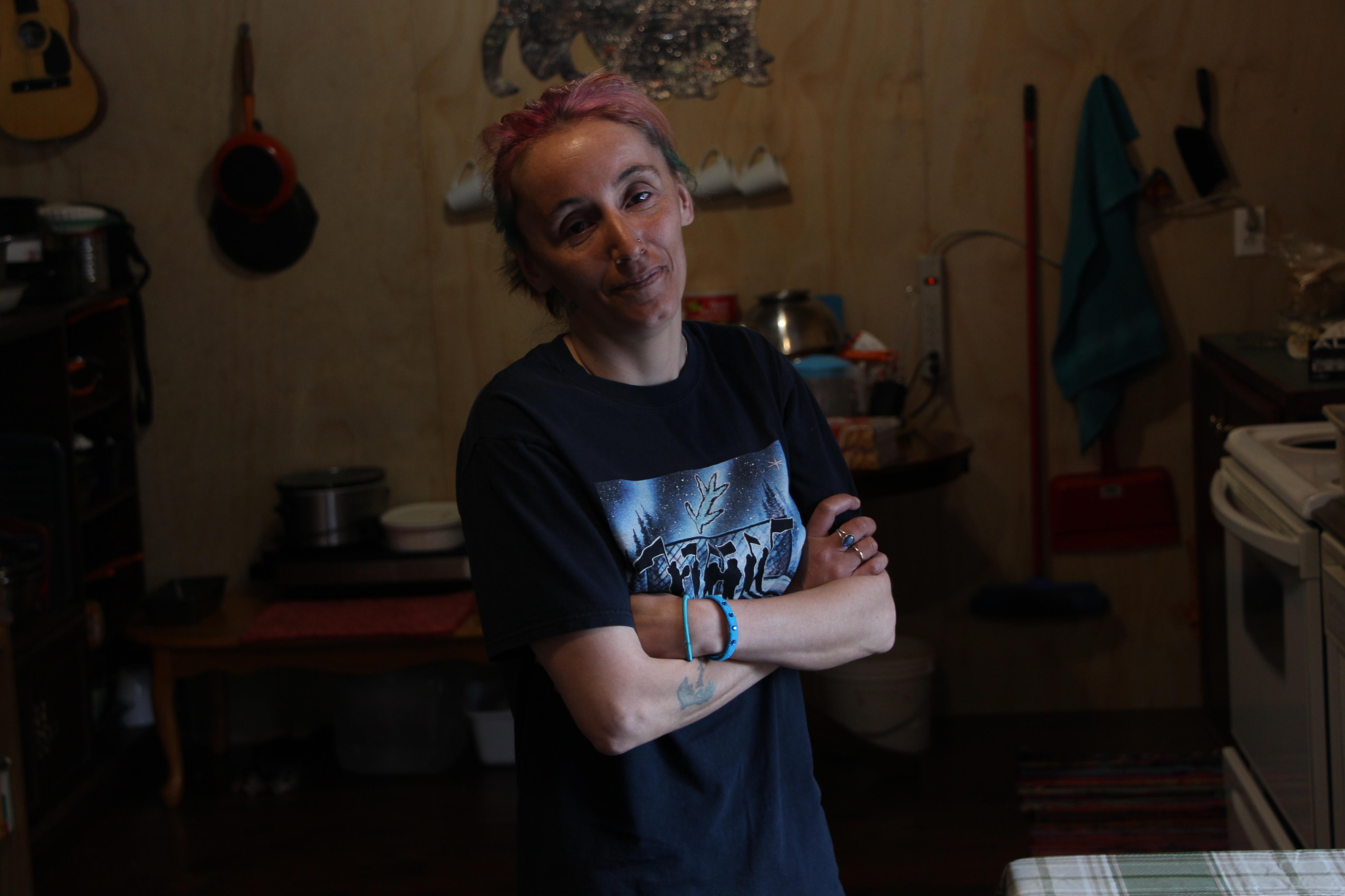 Leanne Rumbolt stands in the kitchen of her damaged home in Mud Lake. (John Gaudi/CBC)