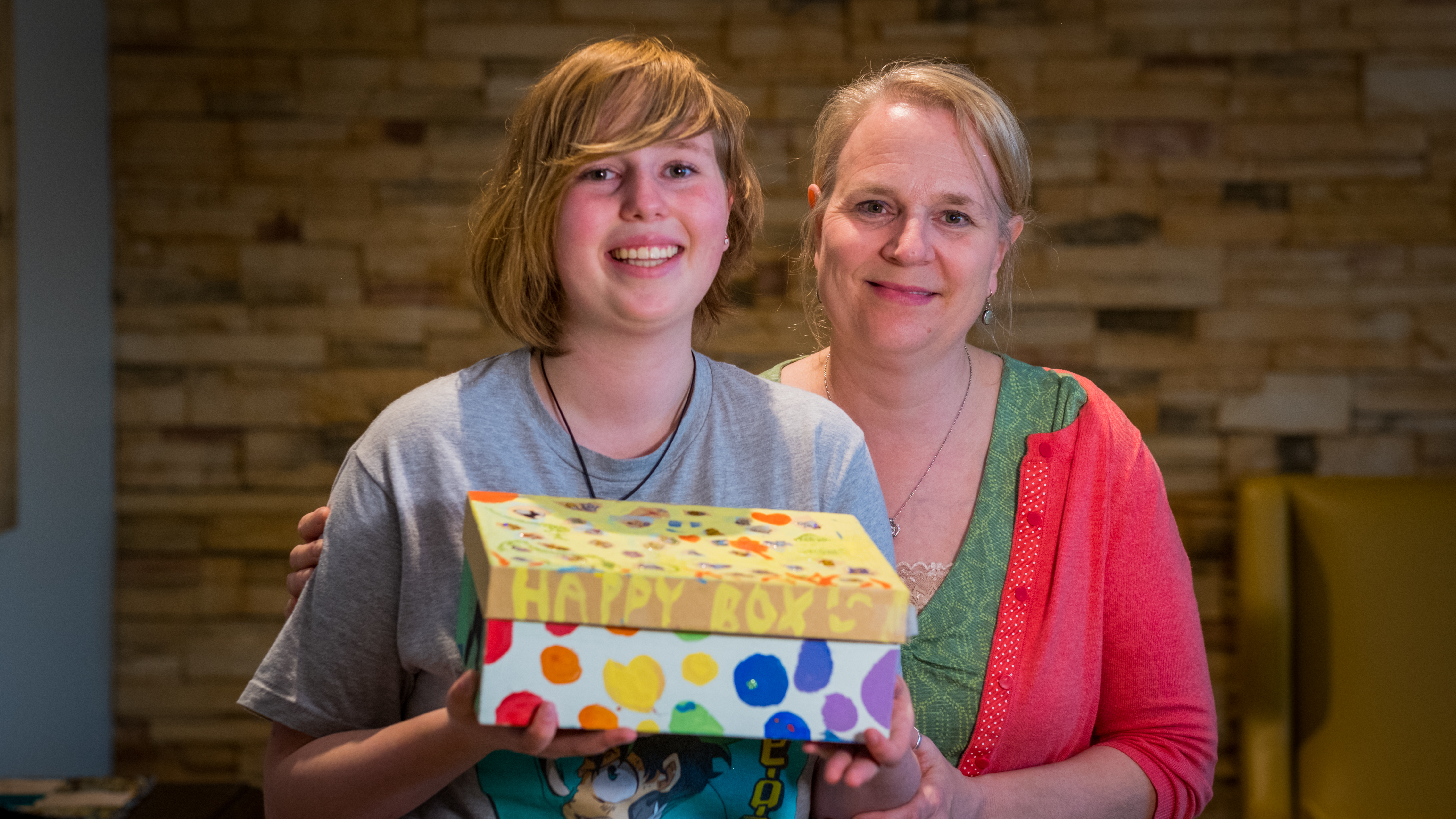 Brigitte Sarte-Dance and Stephanie Dance, with Stephanie's Happy Box. (Michel Aspirot/CBC)