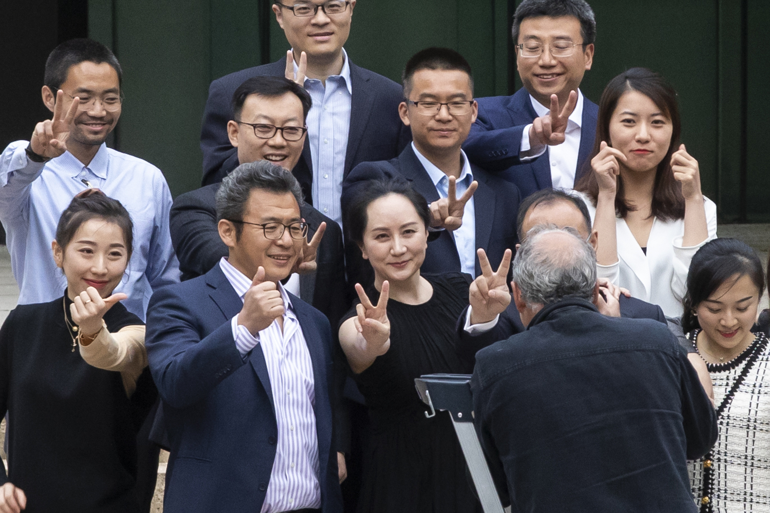 Huawei CFO Meng Wanzhou poses for pictures with friends and supporters on the steps of the B.C. Supreme Court in Vancouver on May 23, 2020. (Ben Nelms/CBC Vancouver)