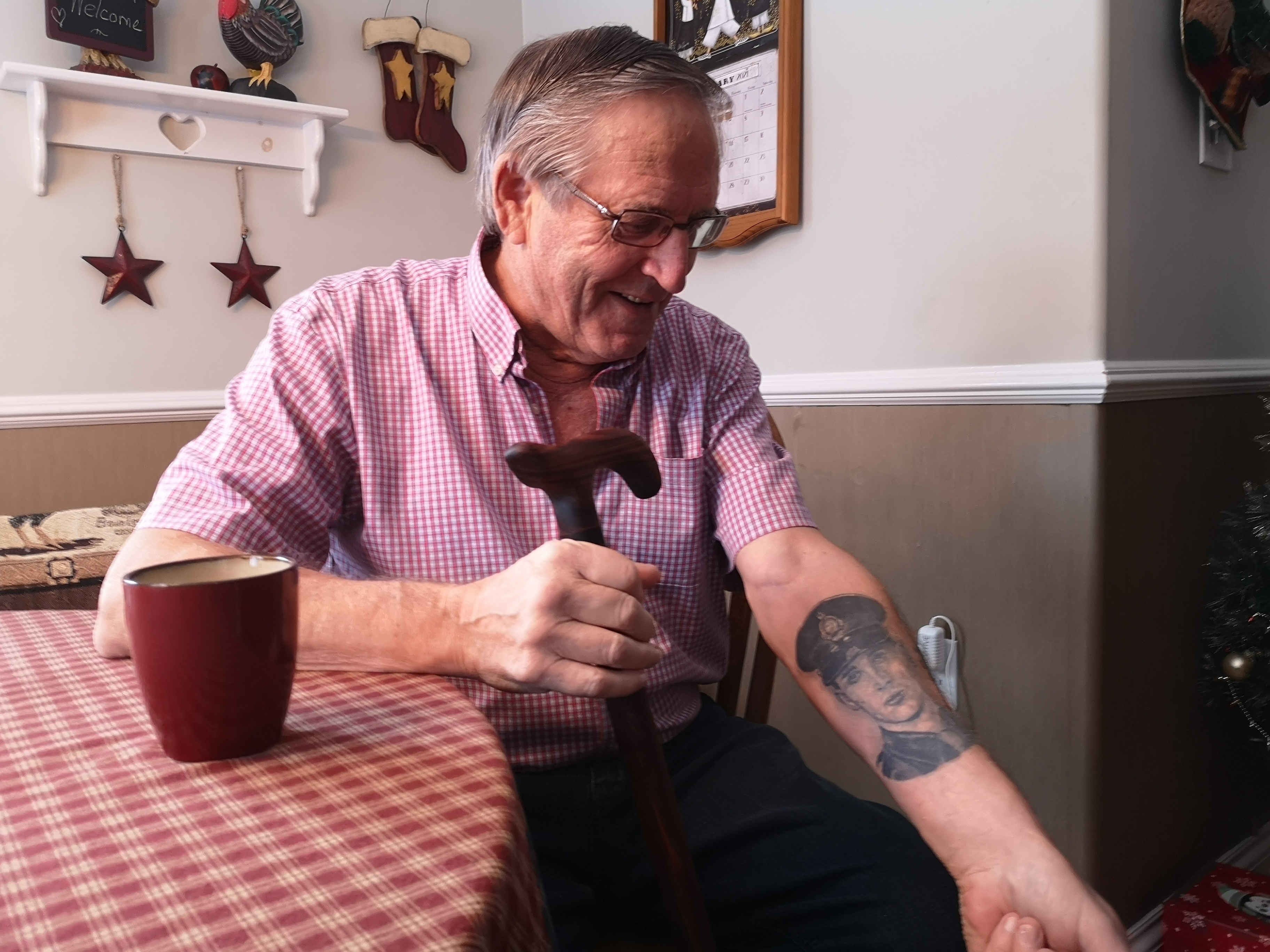 Robert Miller displays a tattoo of his son, Bruce. (Brian MacKay/CBC)