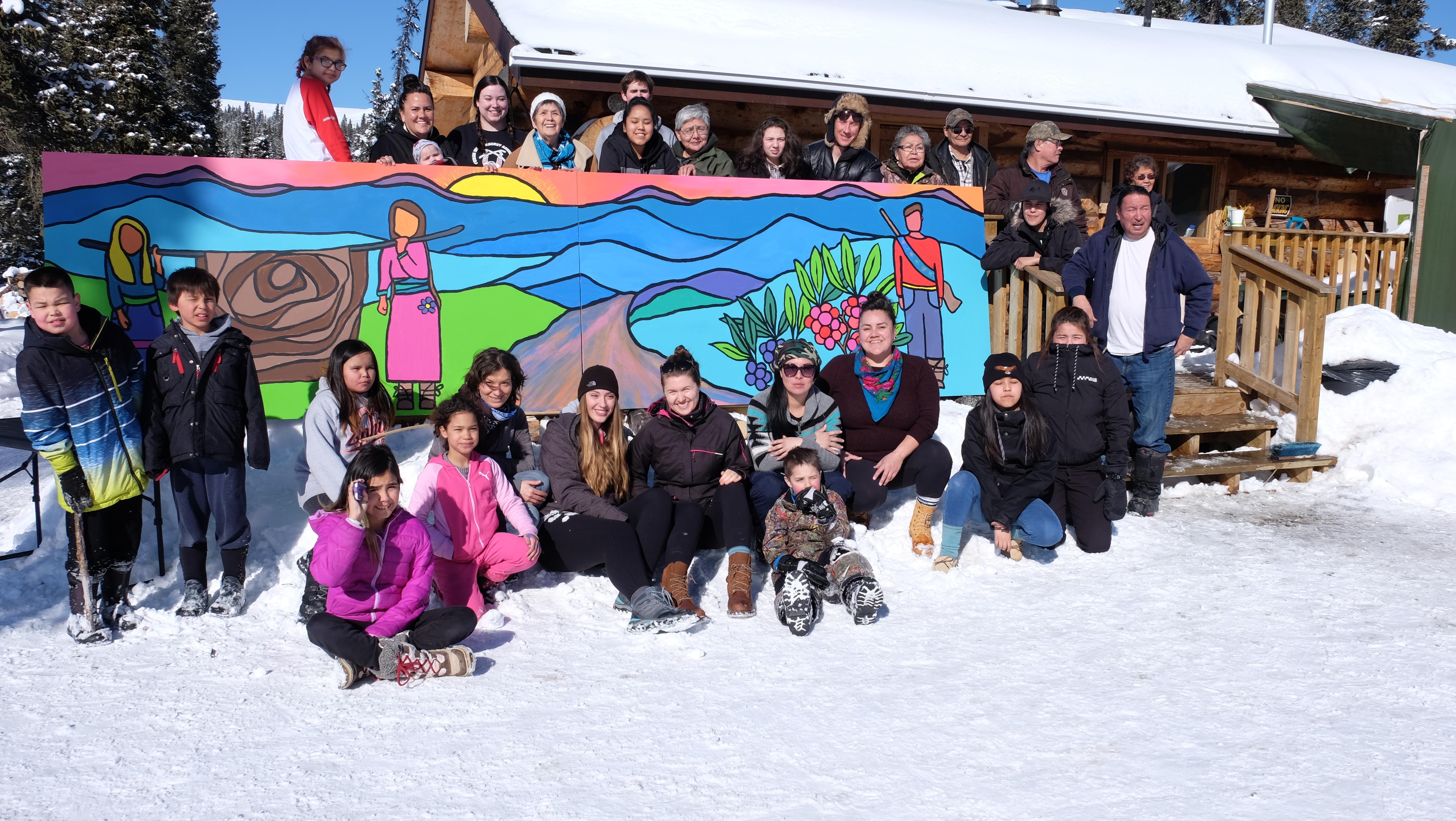 Campers gather around the mural they painted during the camp's first week. (Jane Sponagle/CBC)