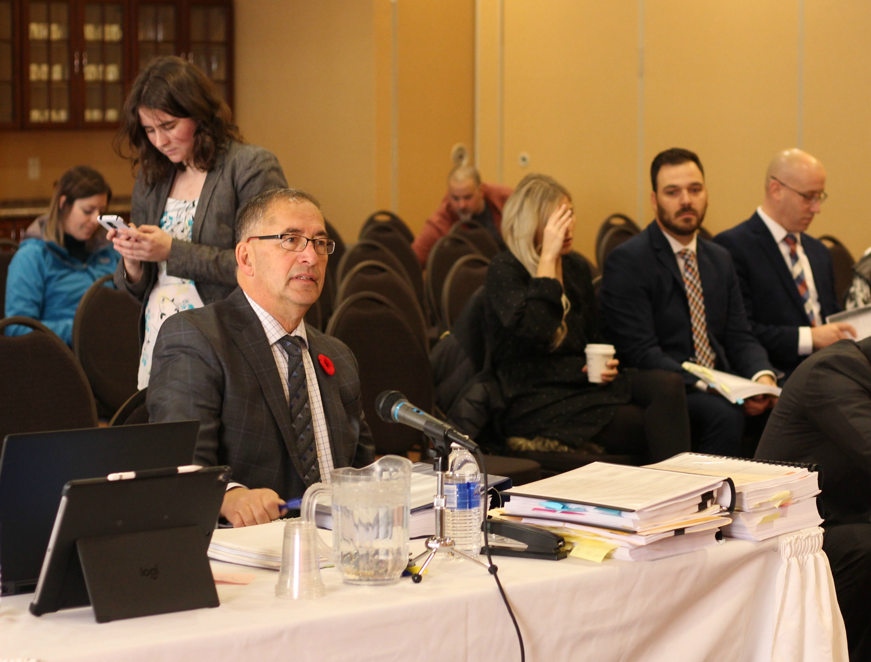 Basile Chiasson, left, is the lawyer representing the Bathurst police chief in a discipline hearing for the two officers. (Shane Magee/CBC)