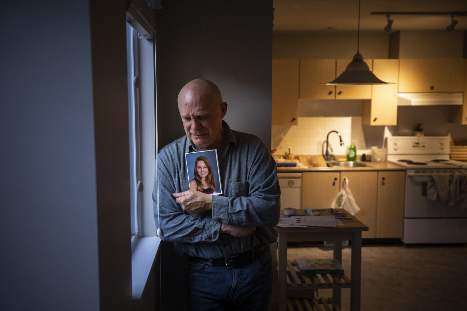 John Butler holds a photo of his daughter Olivia Dalton, who died of a fentanyl overdose in Langley, B.C., on Nov. 3, 2020. (Ben Nelms/CBC Vancouver)