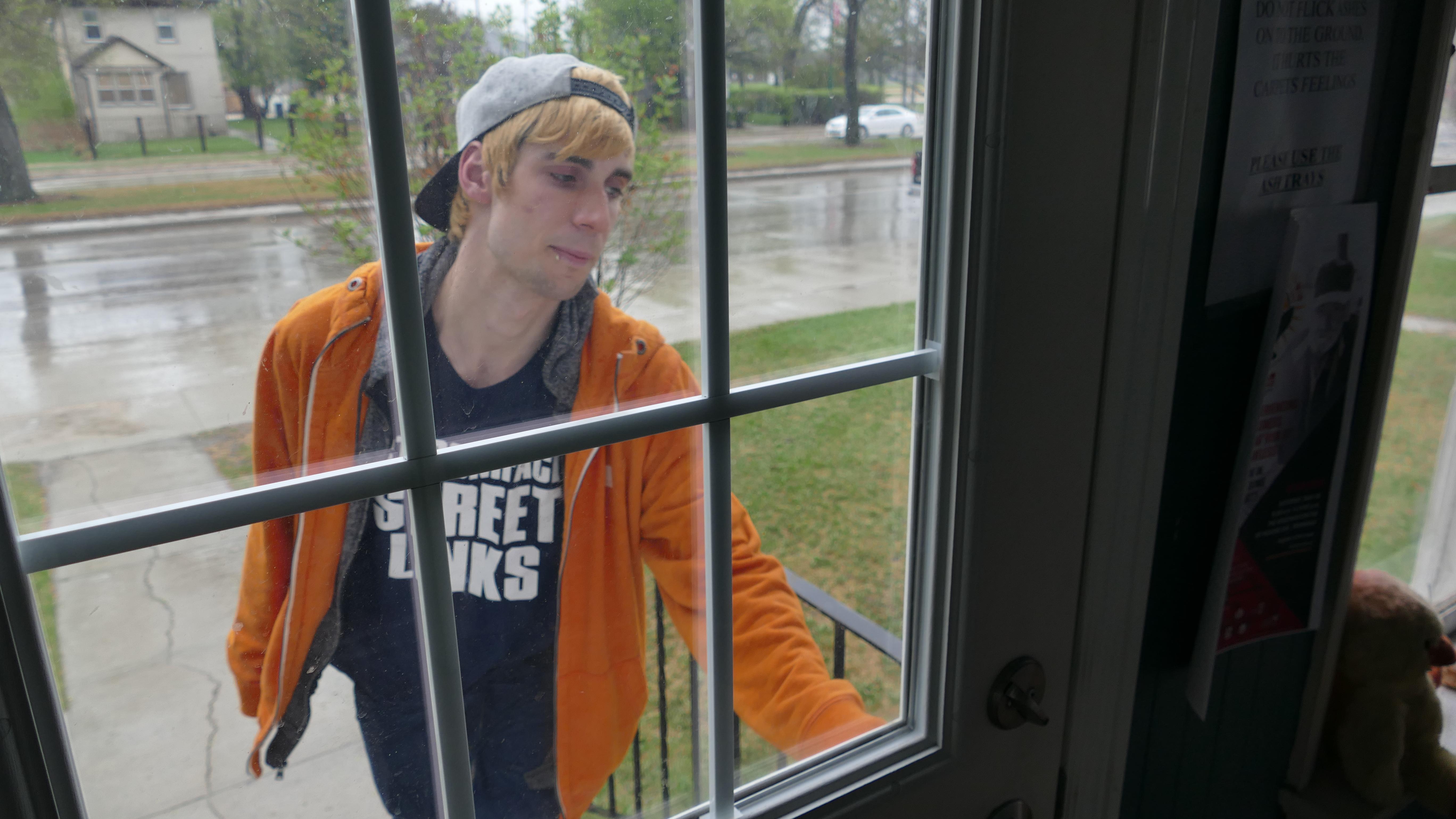 Lavallee opens the door to Morberg House, where he now works. He is considering going back to school to become a counsellor. (Warren Kay/CBC)