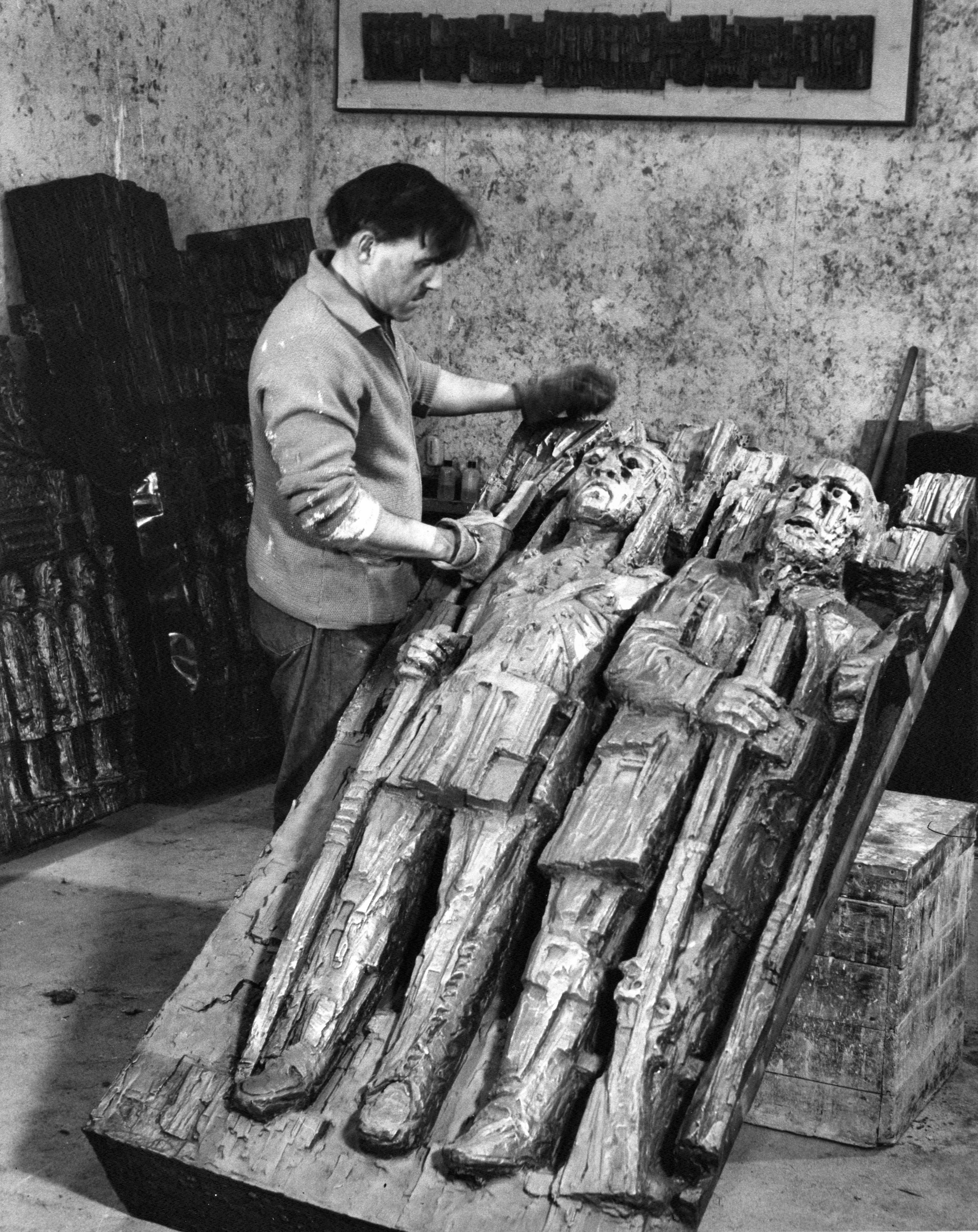 Sculptor John Hooper spent about two years working on the relief mural that is in the lobby of the building. (Provincial Archives of New Brunswick)