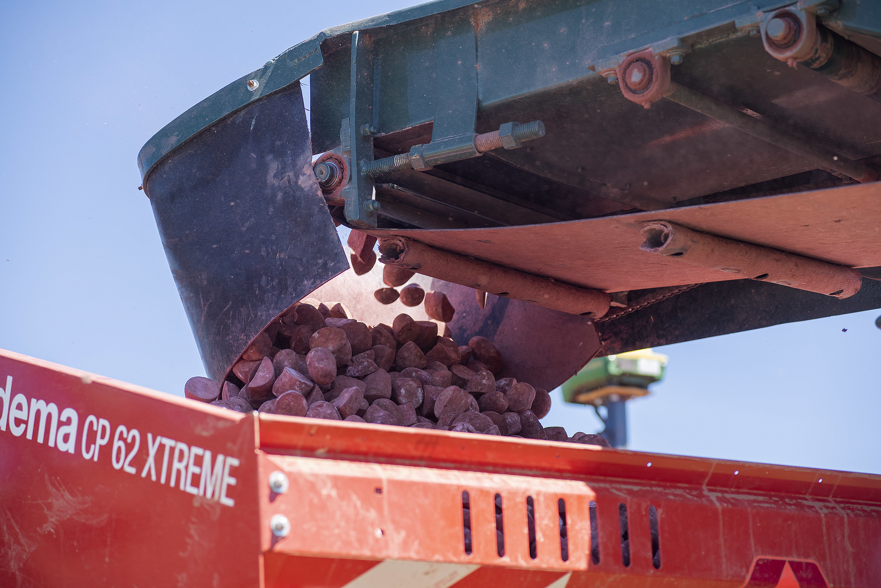 Seed potatoes are loaded into a planter on a field being plowed by Farm Boys Inc. of Arlington. (Brian McInnis)