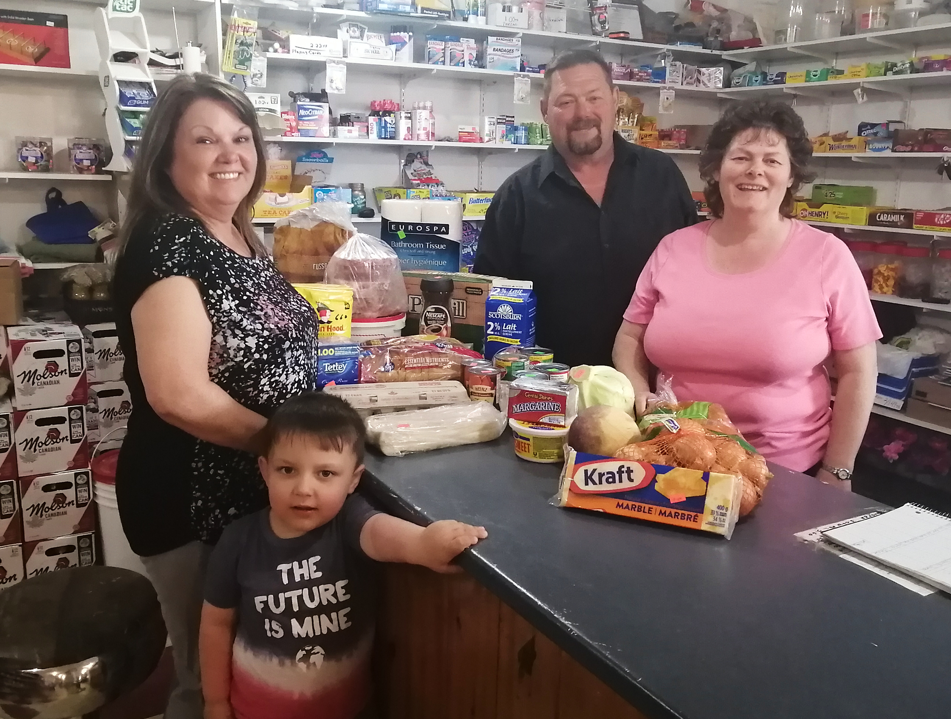 At Perrier's Convenience in Flat Bay, Bernadine Blanchard and Everette Perrier welcome customers ​Marjorie Bennett and Owen Hoskins. ​ (Submitted by Liz LaSaga)