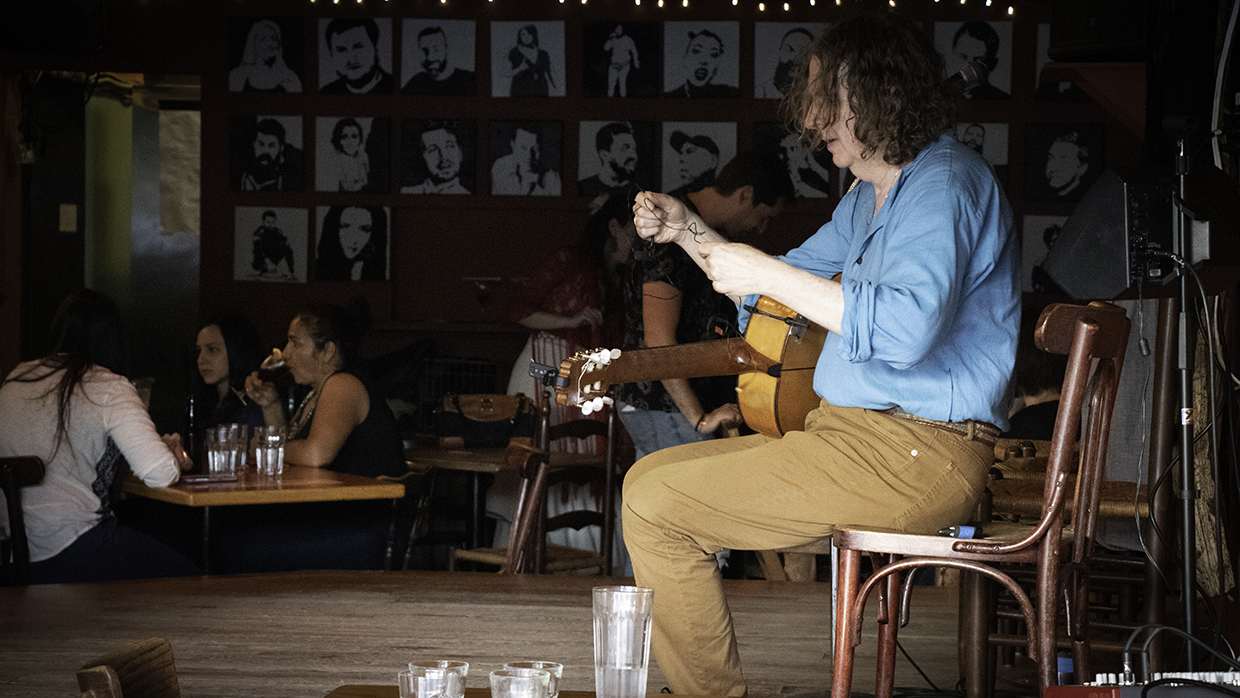 Peter Mole sets up before a gig on Friday night. Mole has been playing flamenco at the Kino for 25 years. (Maryse Zeidler/CBC)