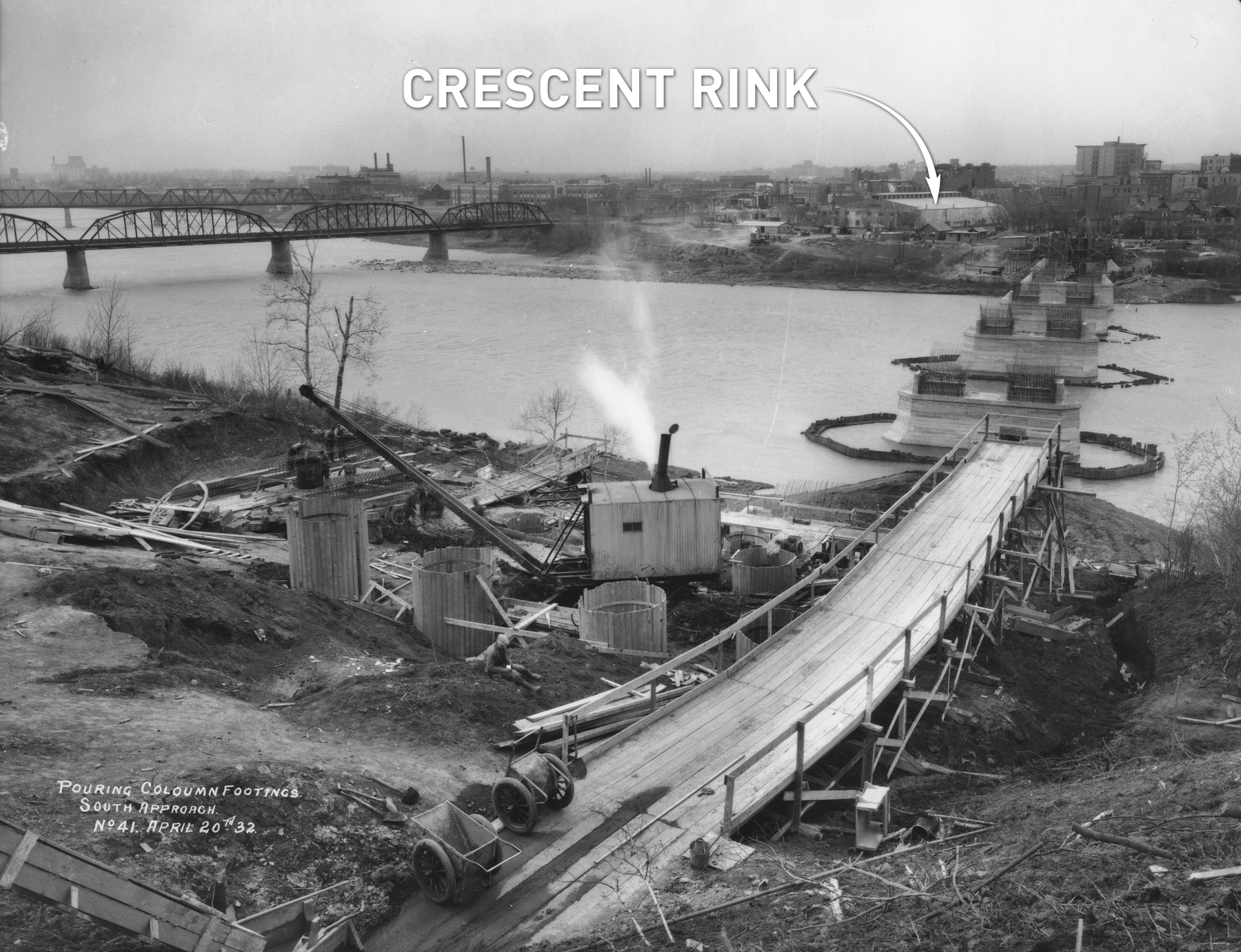 The Broadway Bridge, under construction in 1932. Crescent Rink is on the other side of the South Saskatchewan River. (Saskatoon Public Library Local History Room - Photo A-175)