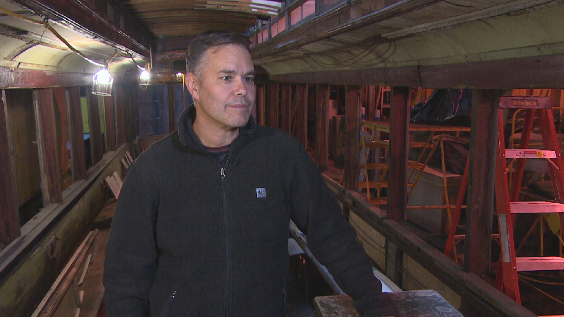 Robert Loiselle stands inside the skeleton of Streetcar 356. (Jeff Stapleton/CBC)