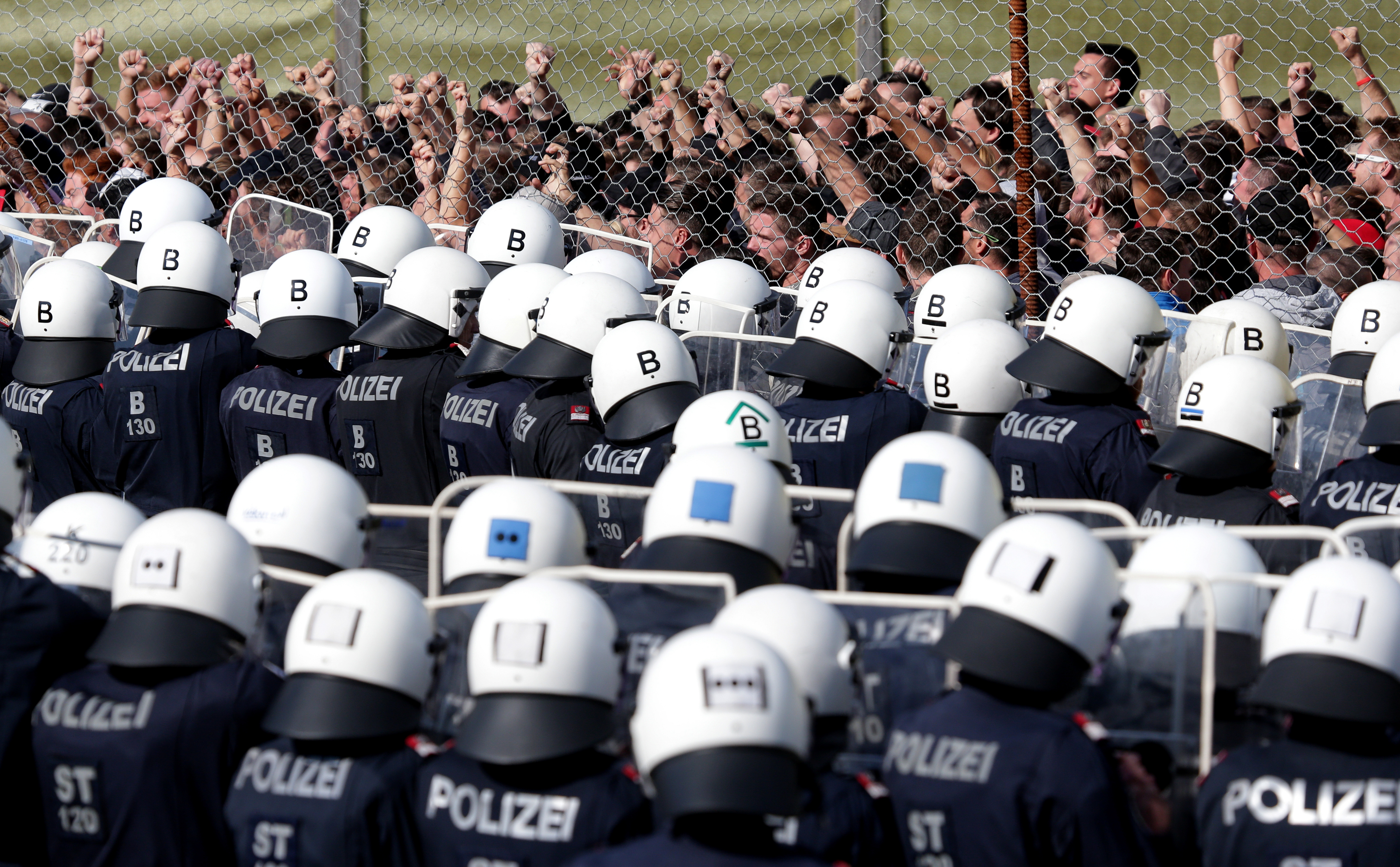 Police officers attend an exercise to prevent migrants from crossing the Austrian border from Slovenia, in Spielfeld, Austria, June 26, 2018. (Lisi Niesner/Reuters)