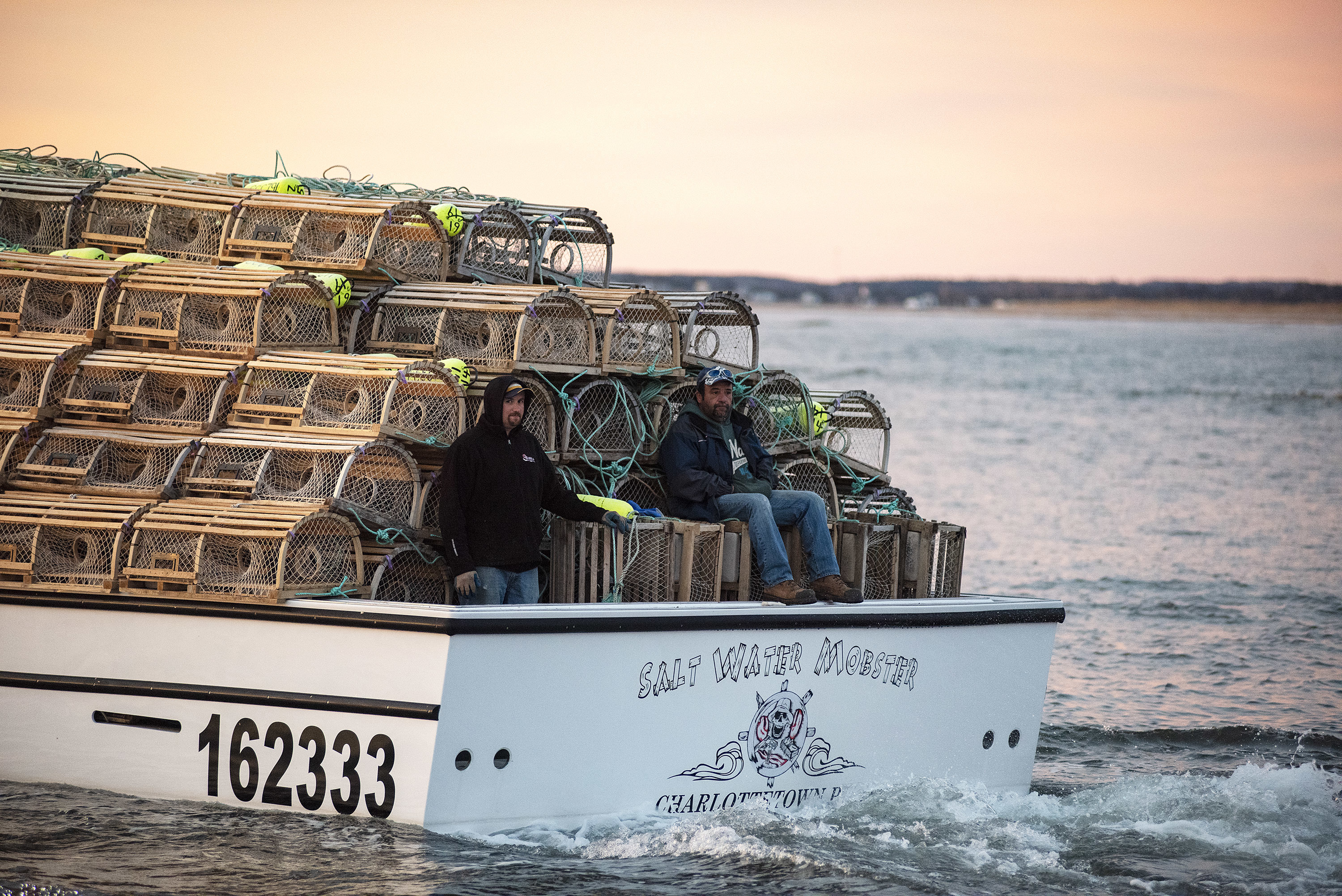 Crew members of Salt Water Mobster relax before the hard work begins as the boat heads out into the Gulf of St. Lawrence. (Brian McInnis)