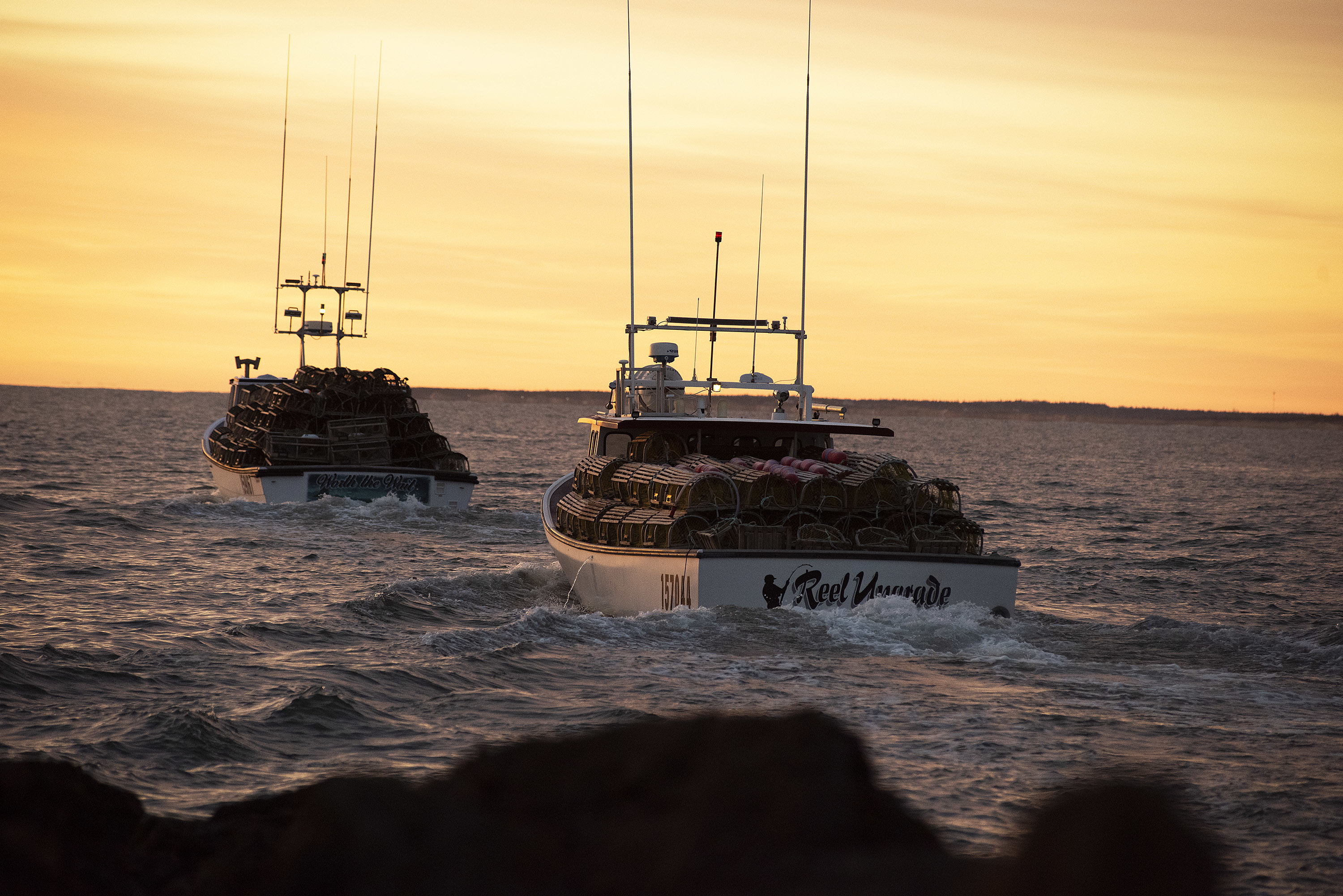 The sun is not yet above the horizon when the boats and their crews head to the staging area. (Brian McInnis)