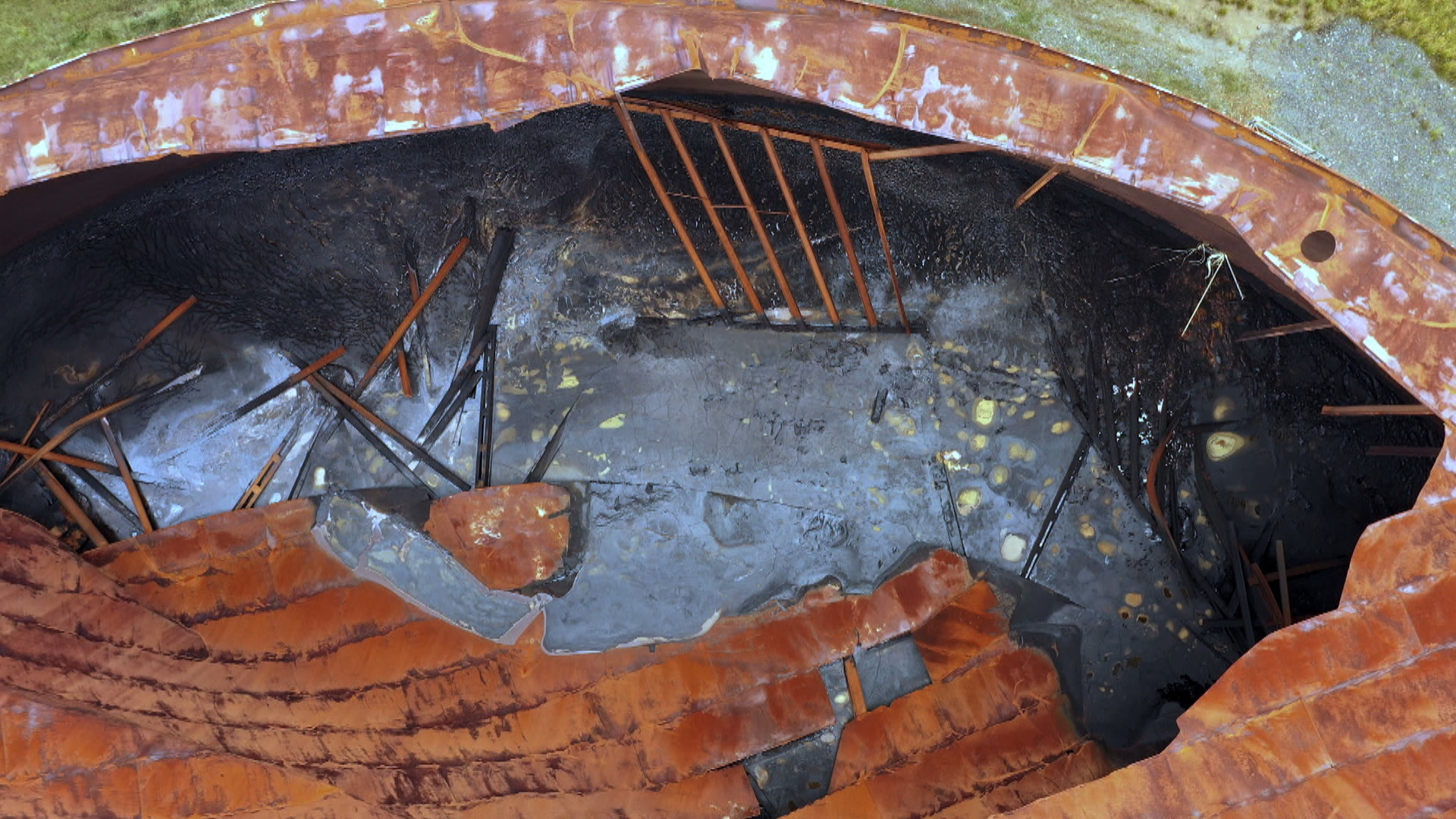 The Newfoundland and Labrador Department of Environment and Climate Change says 'there is no environmental concern' posed by this tank, and the sludge inside 'would not be mobile under normal ambient temperatures.' (CBC)