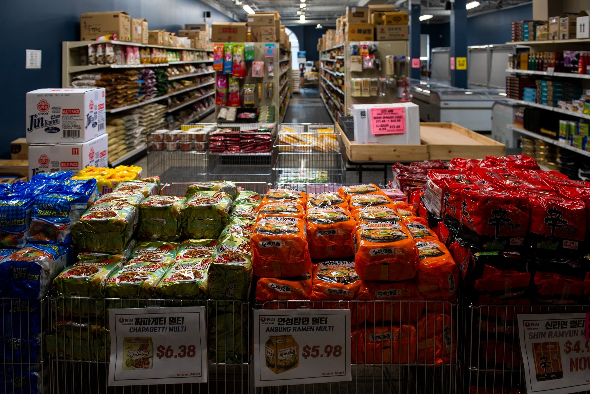 Packages of popular Korean instant noodles are on display at Seoul Mart. (James Park)