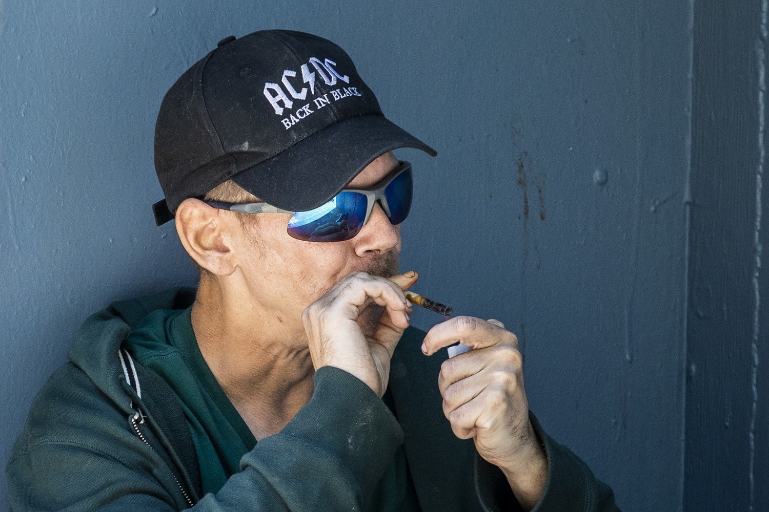 A man smokes drugs along Hastings Street in Vancouver, British Columbia on Friday, September 6, 2019. (Ben Nelms/CBC)