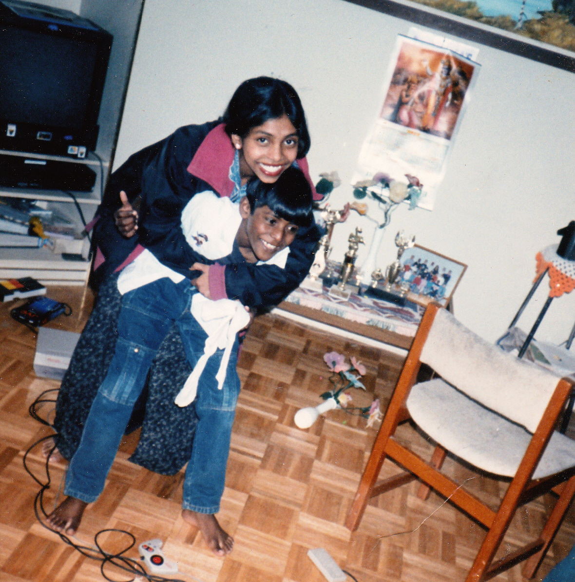 Sharmini is shown with her younger brother, Kathees.