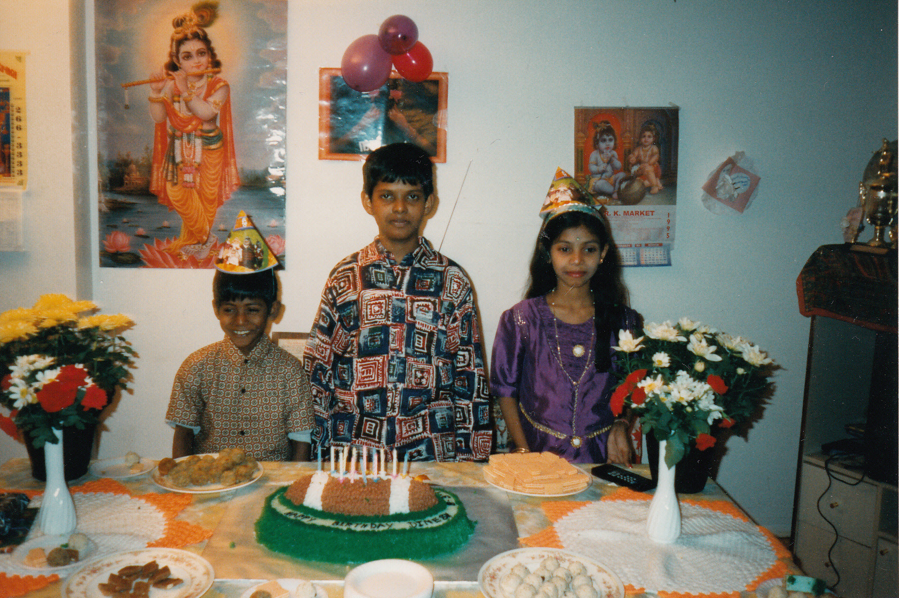 Sharmini is shown with her brothers, Kathees, left, and Dinesh, centre, during a birthday party.