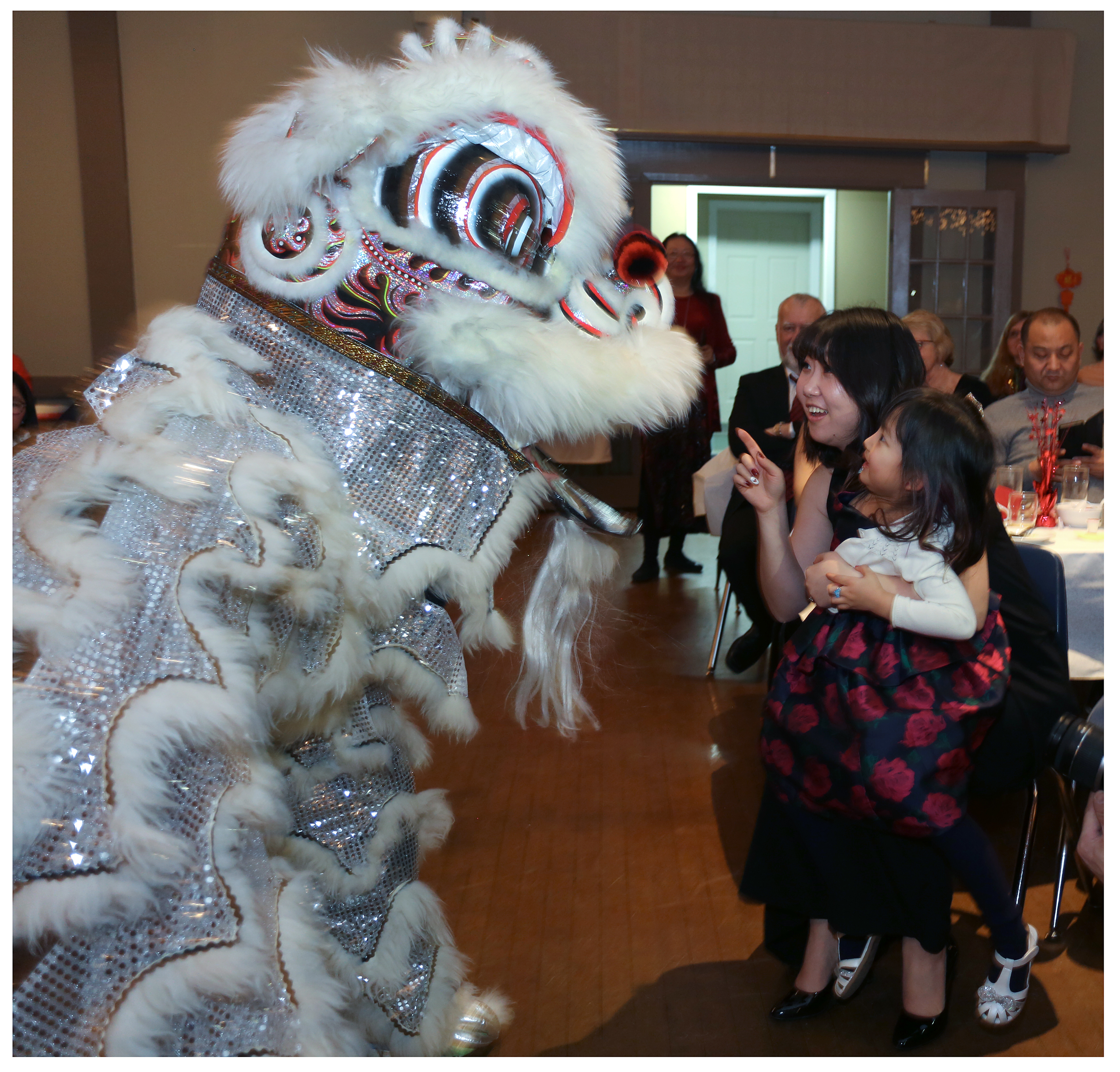 Zhuwei Song holds Diefei Sofia Zhao as they get close with Snowy. 